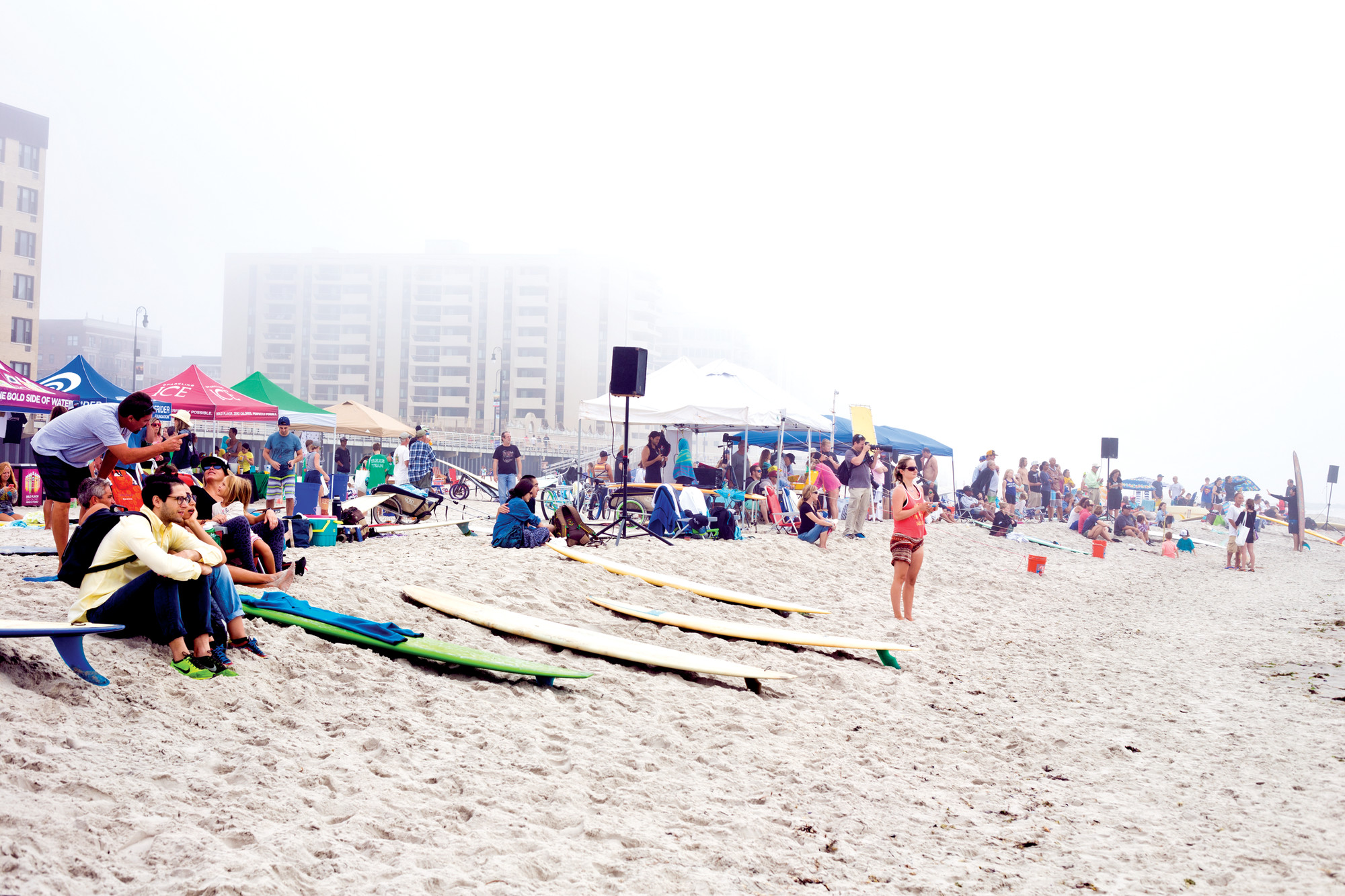 Eric Dunetz/HeraldThe crowd gathered at Long Beach Boulevard beach to watch longboarders compete last Saturday.