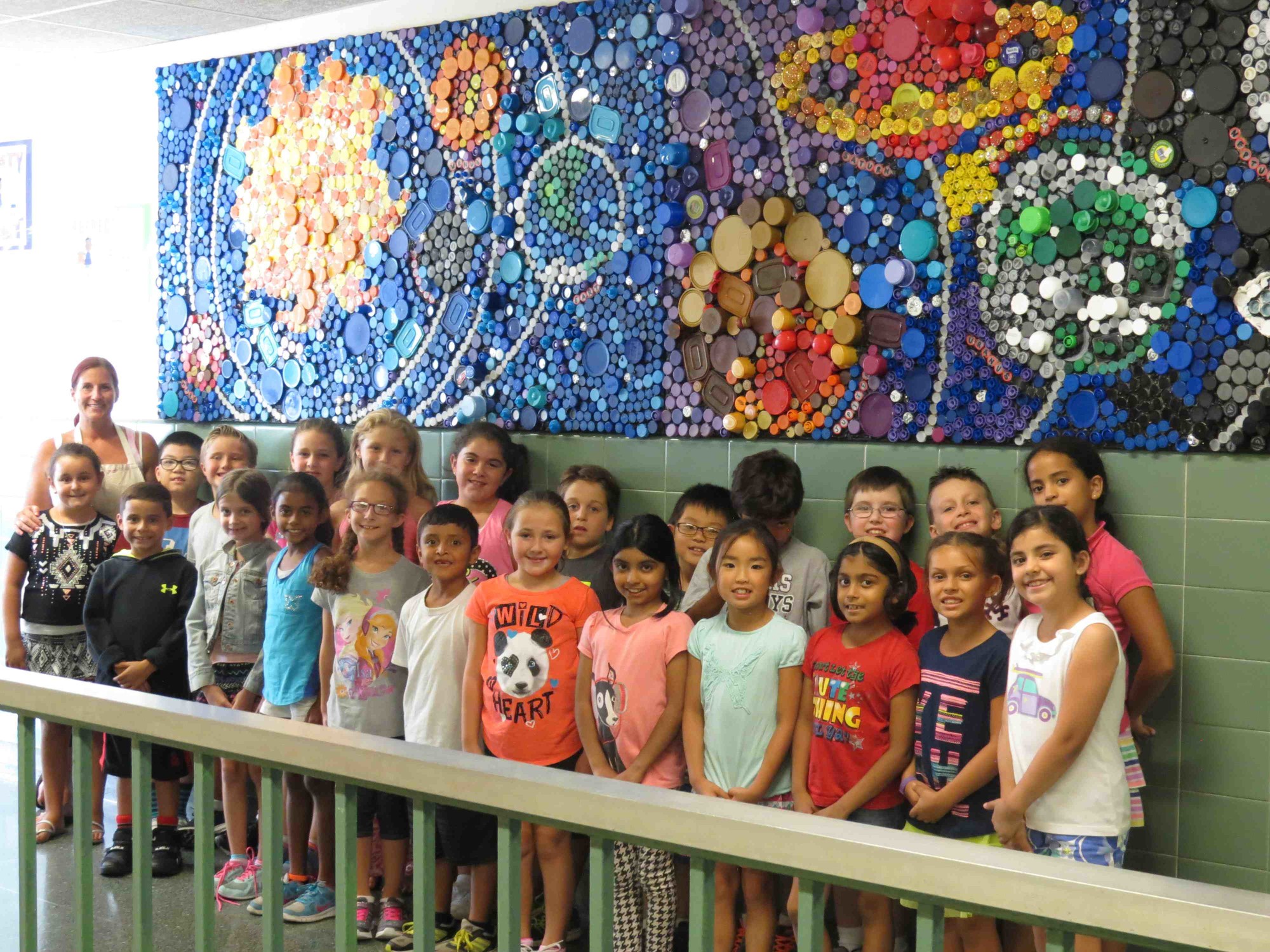 Parkway Elementary School’s fifth-grade art club created the mural of the galaxy using bottle caps.