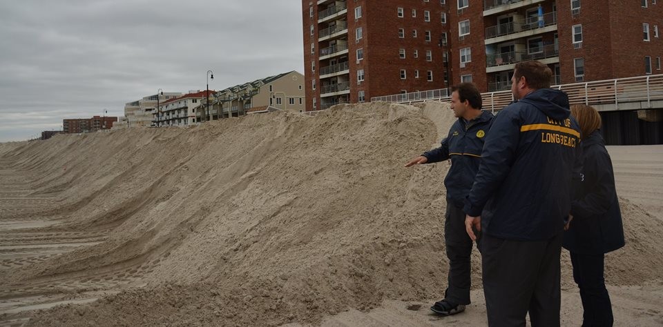 City Councilman Anthony Eramo, left, and other officials observed the berms on Thursday, and though forecasters say that Hurricane Joaquin appears to be veering to the east, it could bring heavy rain and wind to the area.