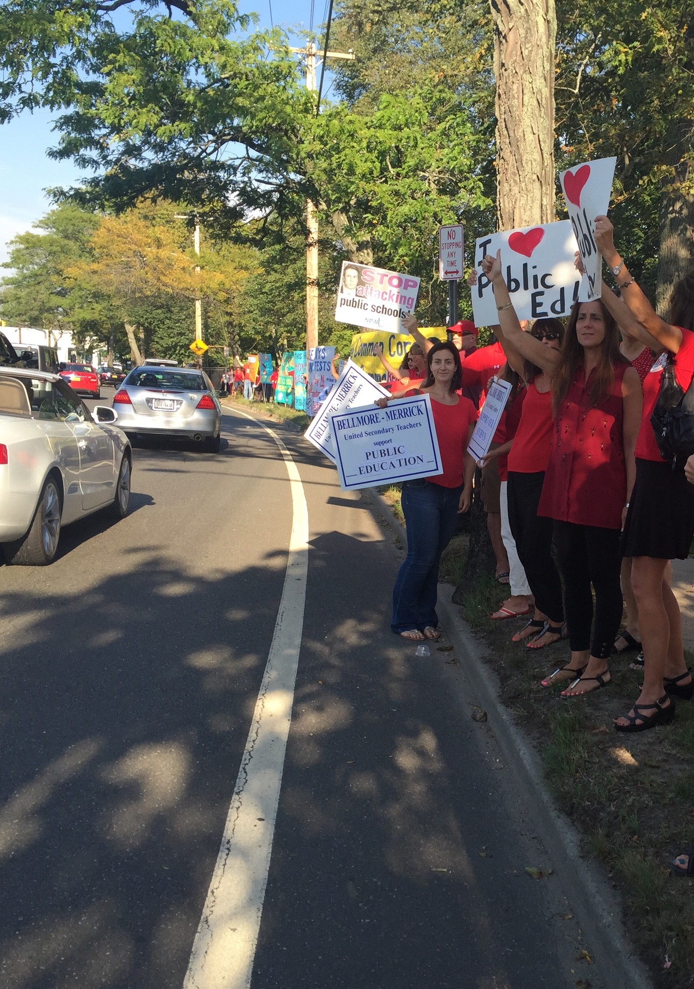 Teachers urged Merrick Road motorists to honk their car horns in support of public education.