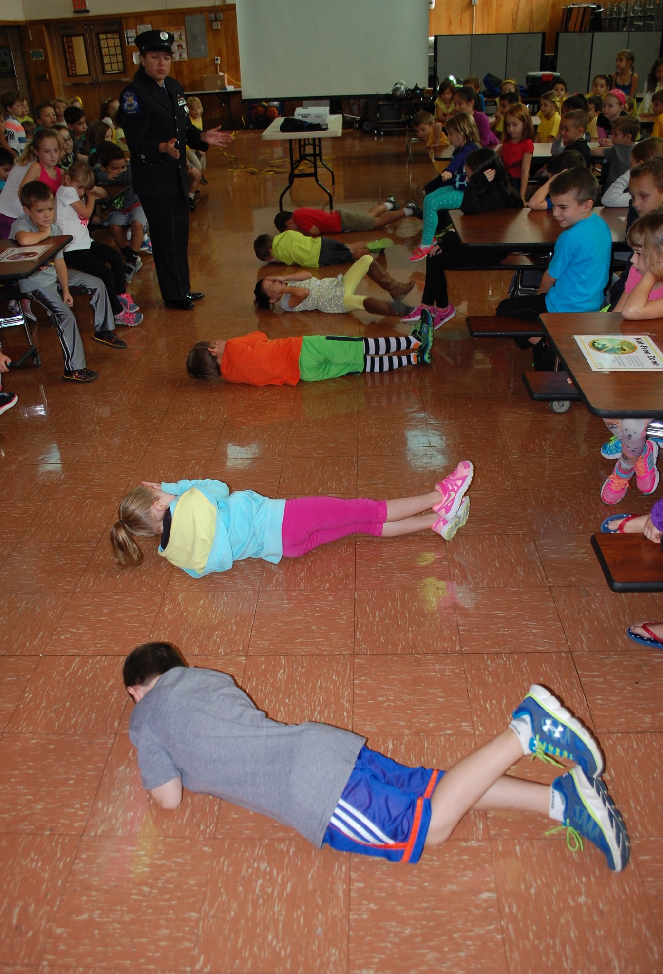 Firefighter Marcela Loeber taught children how to stop, drop and roll.