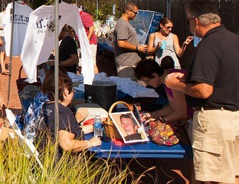 The 6th annual Mark Dejak Memorial Picnic, held on Sat. Sept. 19 at Mason Beach in Island Park, was a huge success for the Making-A-Difference Foundation. Mark’s photo in displayed on the table.