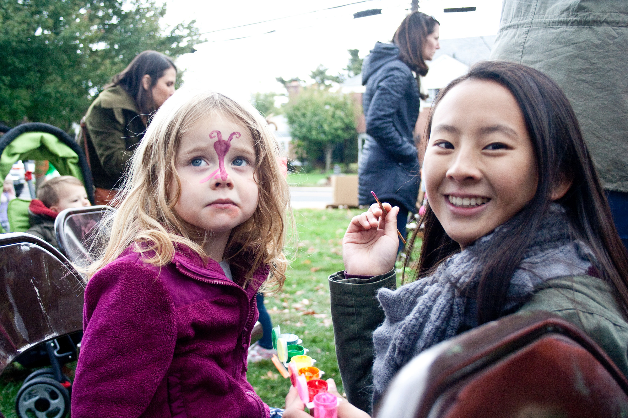 Liana Lo painted a butterfly on the face of Devin Mullaney, 3.