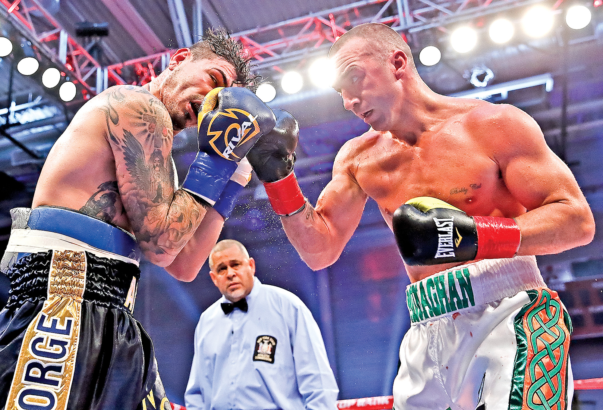Courtesy Mikey WilliamsIn a thrilling 10-round bout, Long Beach’s own “Irish” Seanie Monaghan, right, defeated Chicago’s Donovan “Da Bomb” George last Friday and clinched the North American Boxing Organization light heavyweight title. Monaghan also ran his perfect record to 26-0, with 16 knockouts.