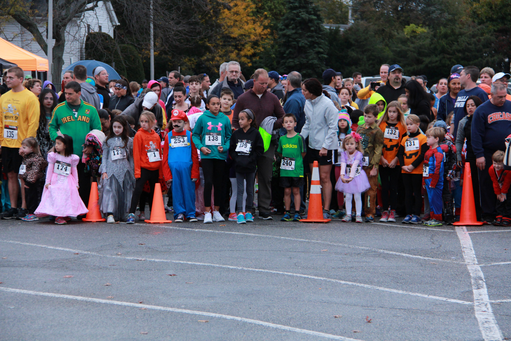 Children lined up for the Trick-or-Trot, the half-mile race before the main event last Saturday morning.