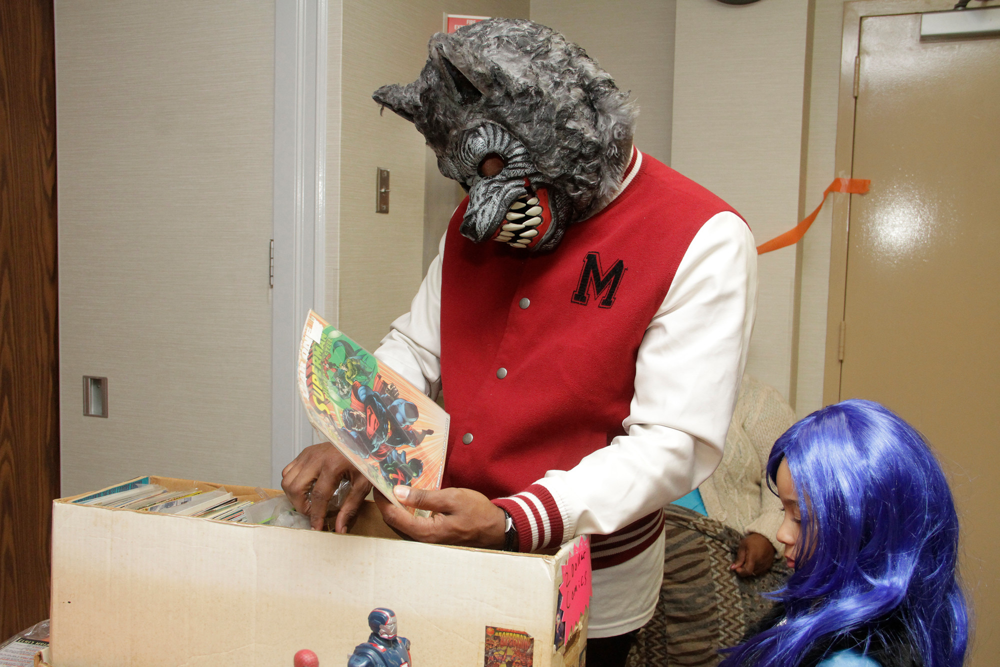 Teen wolf Michael Cameron and his daughter Madison browsed comic books.