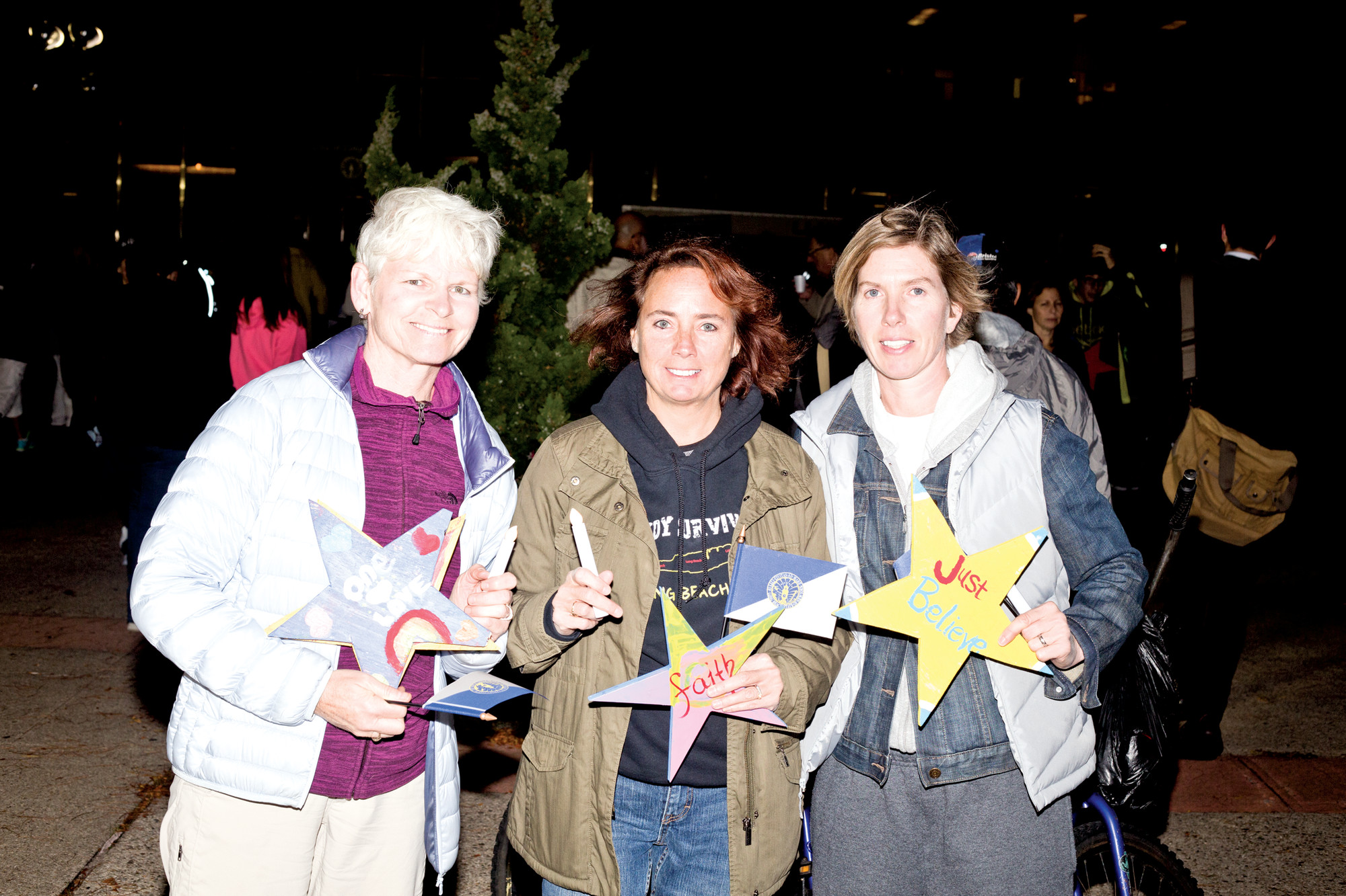 Jennifer Hoeppner, far left, Penny Ryan and Ann Walsh with their “Stars of Hope” at last week’s ceremony.