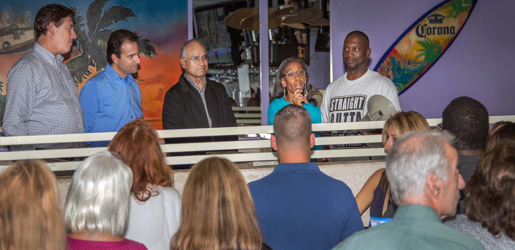 Anissa Moore addressed supporters at Billy’s Beach Café on Tuesday alongside her running mates Anthony Eramo and Len Torres, second and third from left.