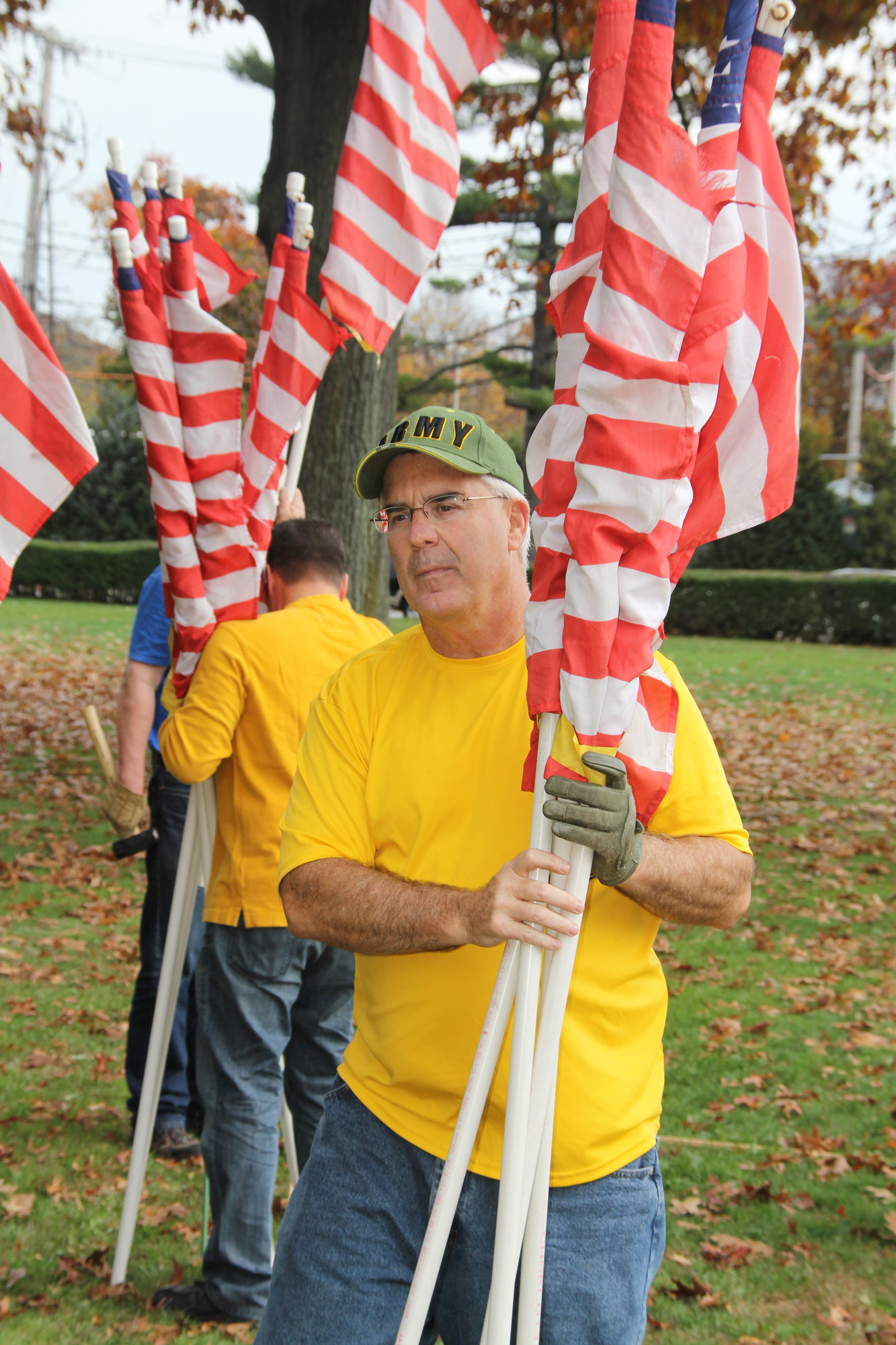 Seaford american legion past Commander and Judge Terence Murphy, a lieutenant colonel in the U.S. Army Reserves, helped place the flags.