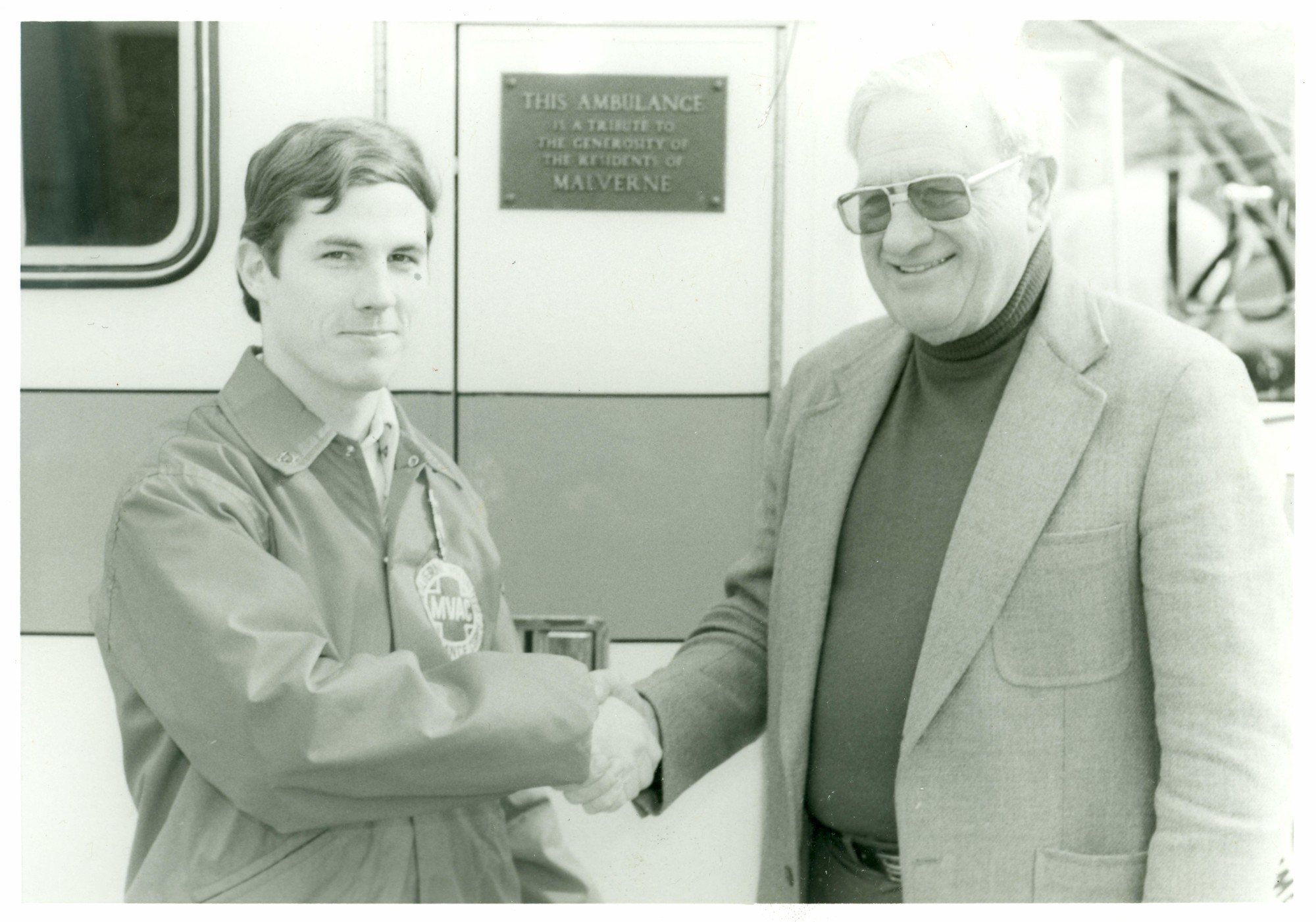 A young Bill Malone with Malverne Mayor Stewart Morrow during the dedication of a new ambulance in 1983.