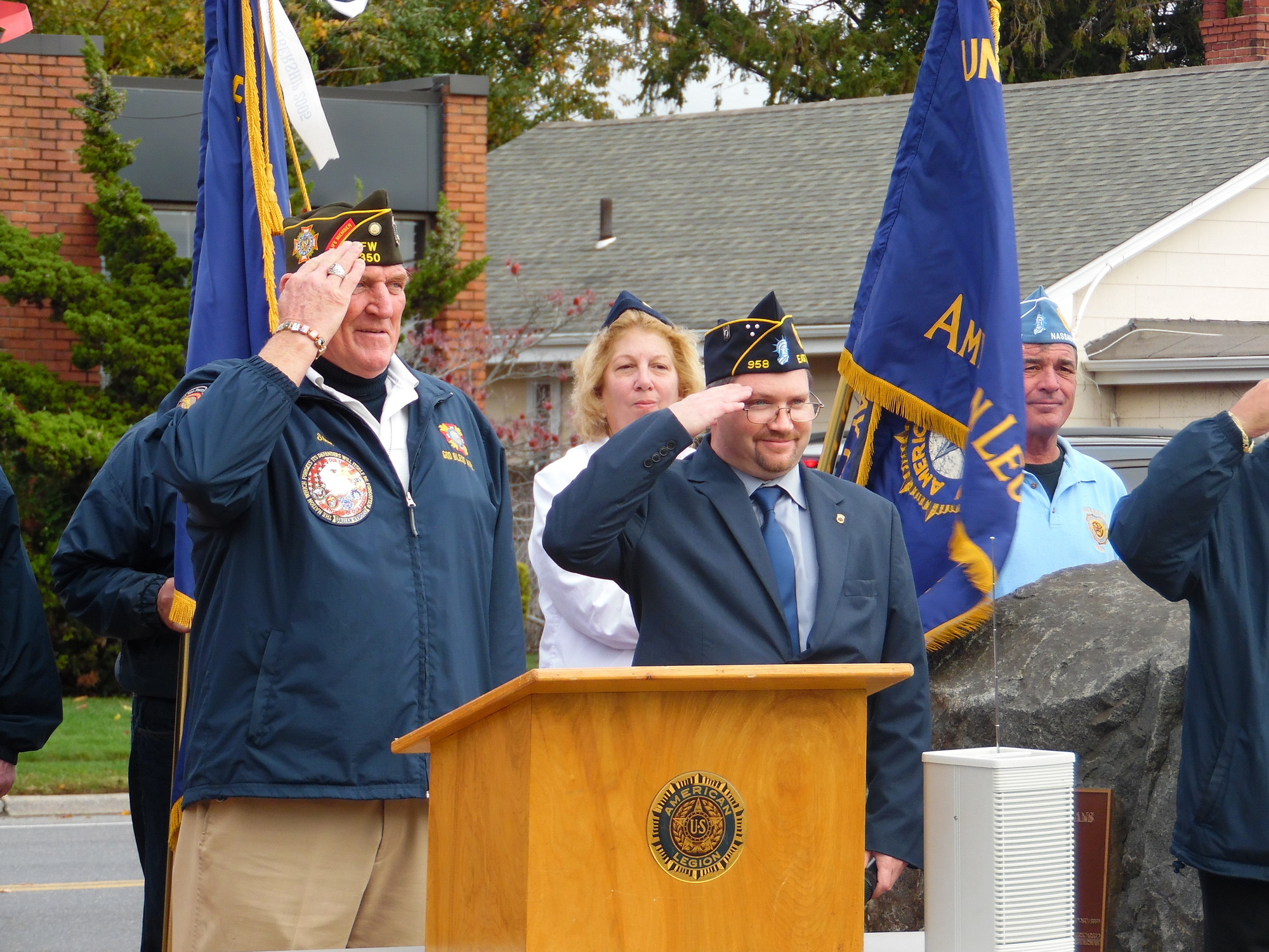 VFW Commander Steve Owen, left, and American Legion Commander Dean Fenton saluted at the end of the service at Veterans Triangle in East Rockaway.