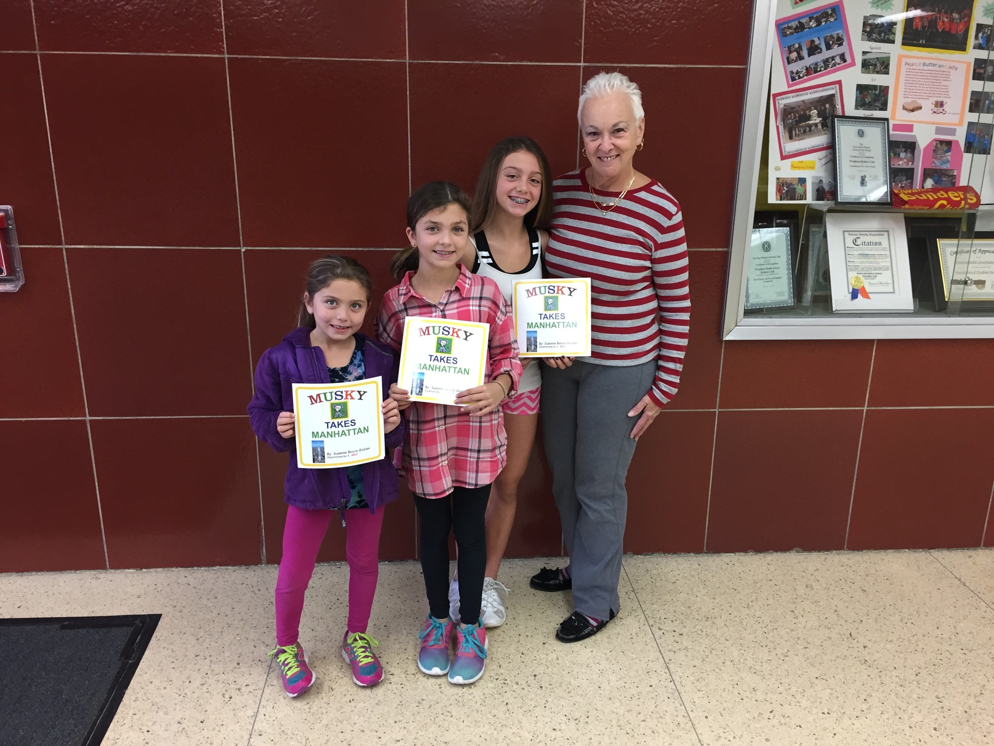 Susan Giuliani said her granddaughters, from left, Isabella, Lauren and Emily Stea,  helped illustrate her new book, “Musky Takes Manhattan.”