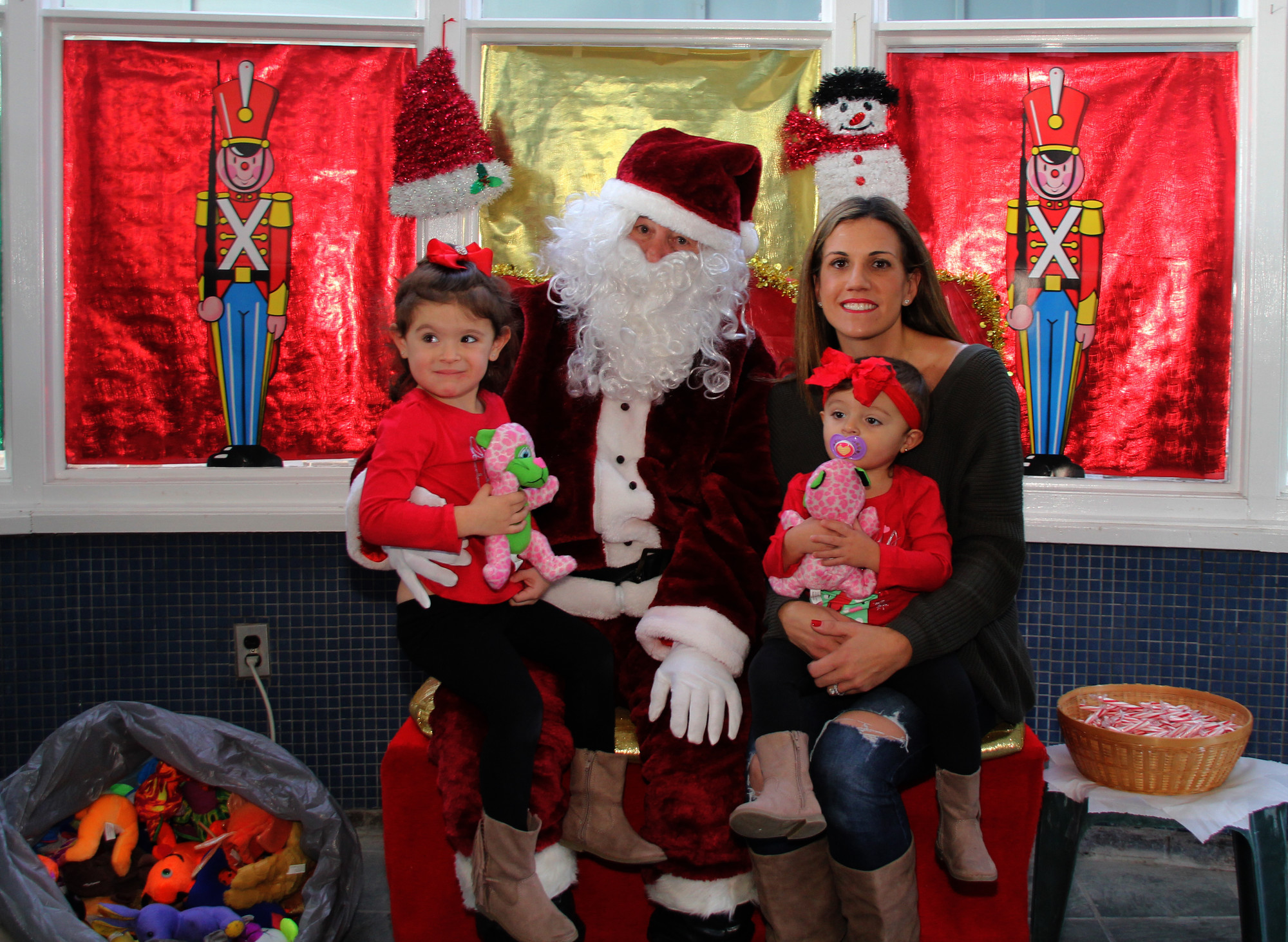 Paula Reid and her daughters, Victoria, 3, and Sienna, 19 months, stopped by Santa in the Park last Saturday.