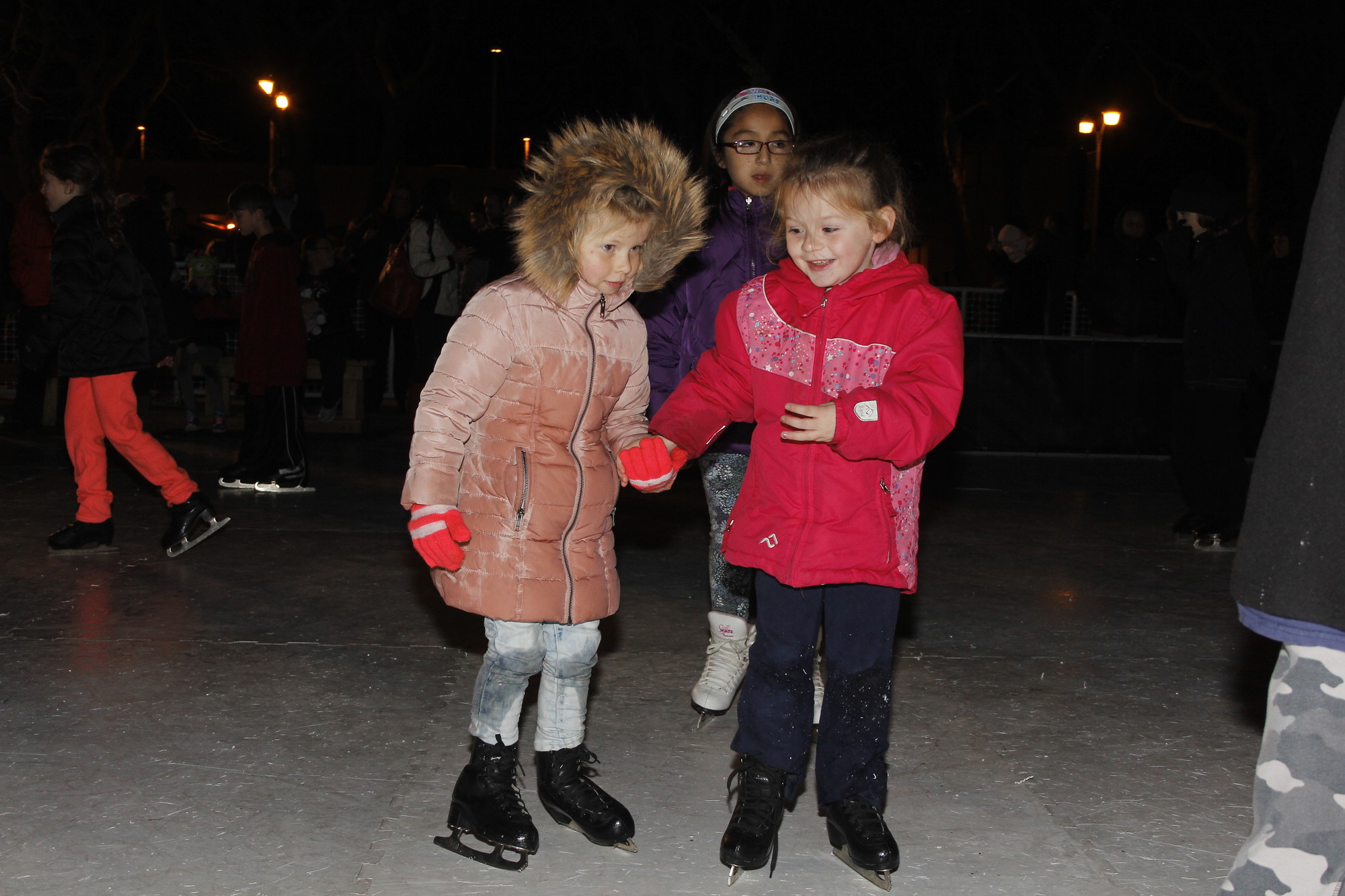 New friends Logan Rodabaugh and Francesca Passaro helped each other around the rink.