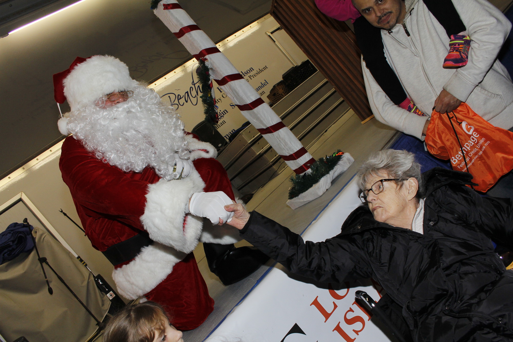 Santa’s oldest fan, Veronica Gagliardi, 93, reached up to shake his hand.