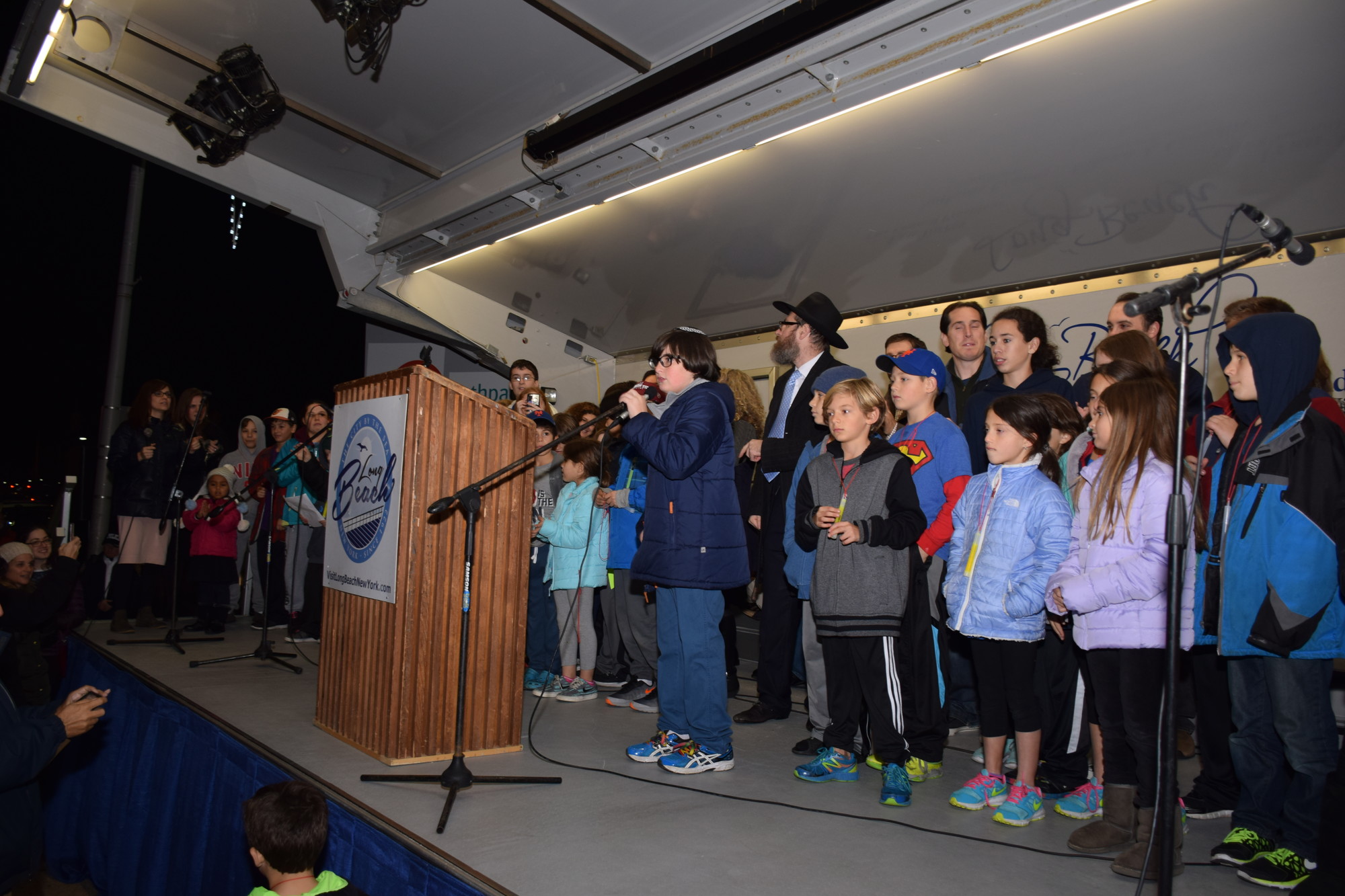 Soloist Jacob LoCascio led his fellow Hebrew school students in singing Hanukkah songs at Sunday’s ceremony.