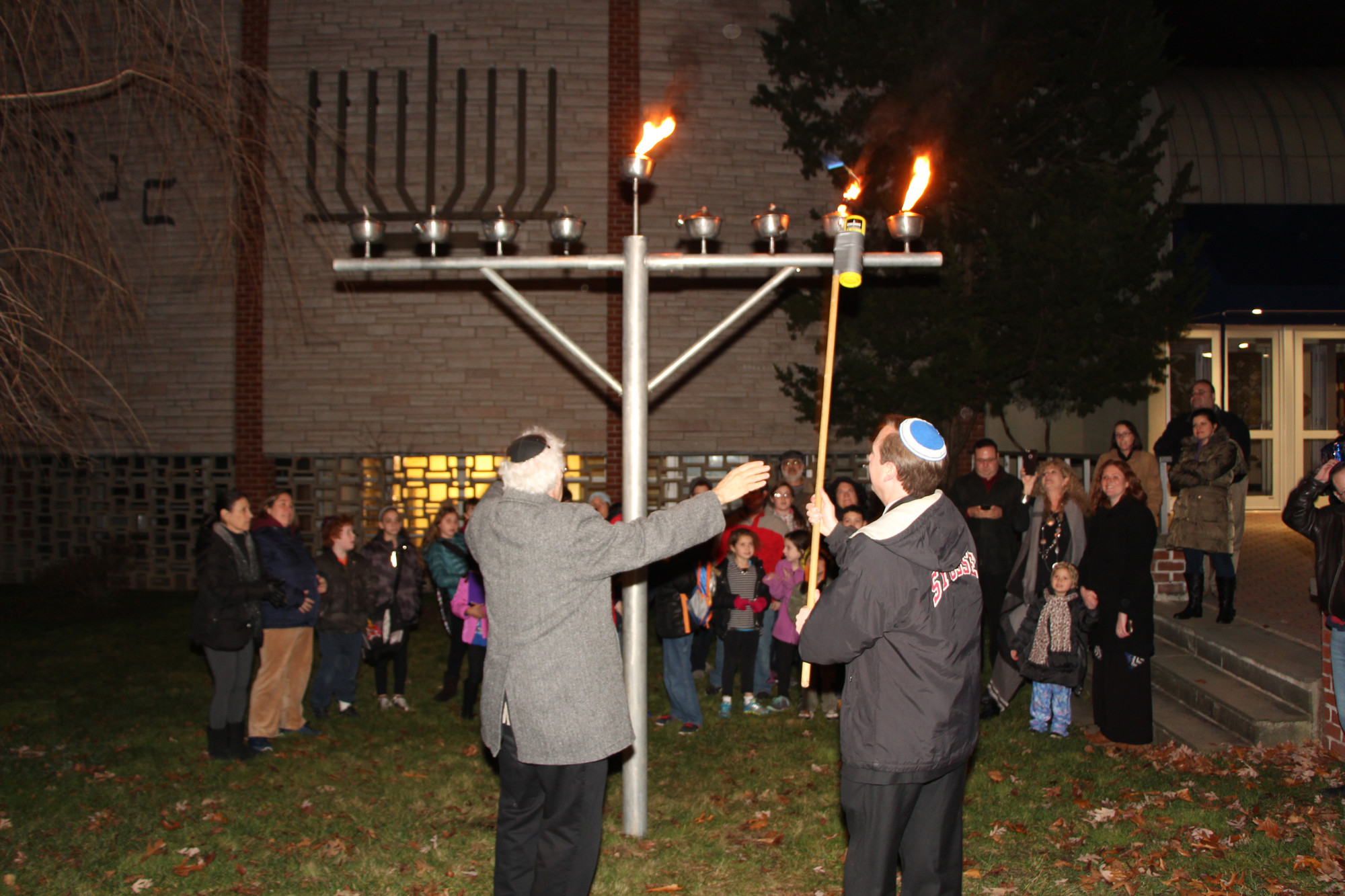 Scott Eckers, an East Meadow School District Board of Education trustee, lit the second candle on the East Meadow Jewish Center’s oversized menorah. The menorah is located on the front lawn of the temple, at 1400 Prospect Ave.
