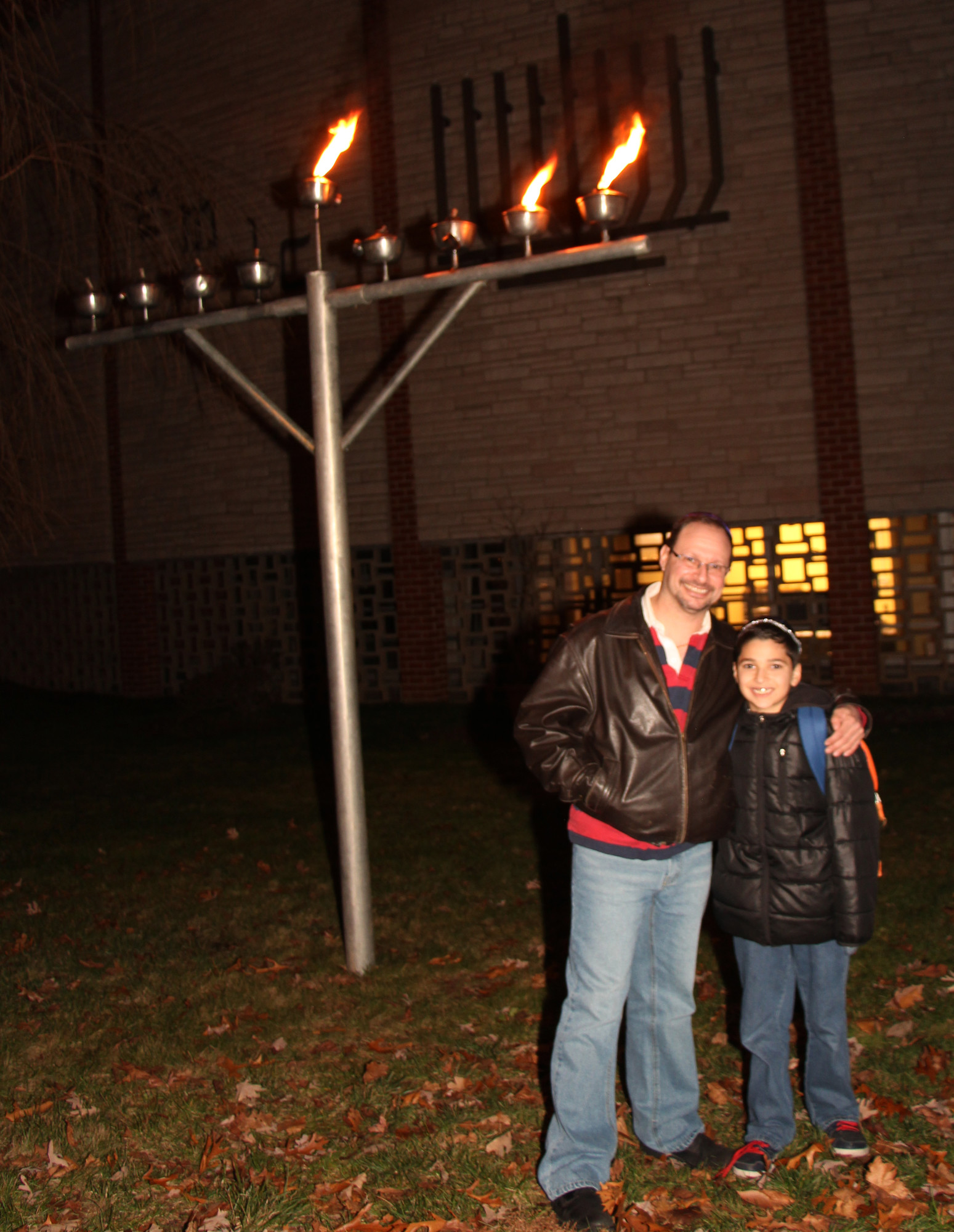Jordan Silver and his son Adam (11yrs) celebrate the Chanukah Holidays at the East Meadow Jewish Center.