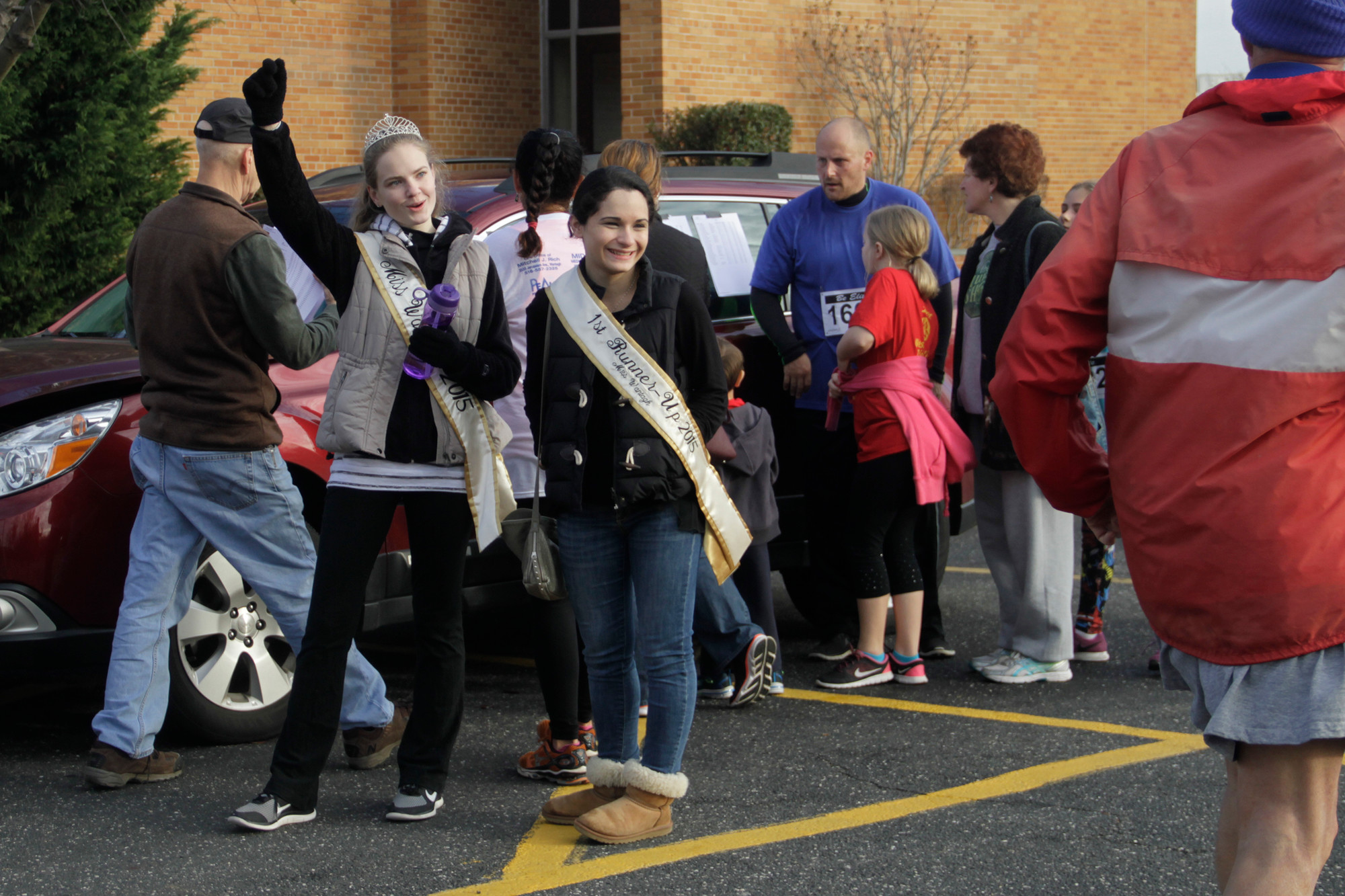 Miss Wantagh Keri Balnis, left, and first runner-up Ruth Kupperberg greeted the 213 runners as they finished the five-mile race at the middle school.