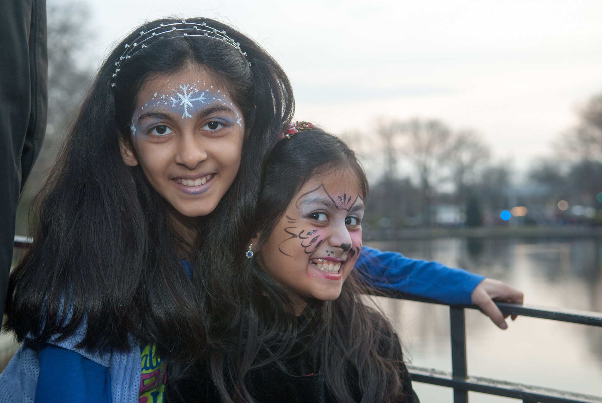Sisters, Naveeha and Warishah, show off their face painting which they thought was "really good".