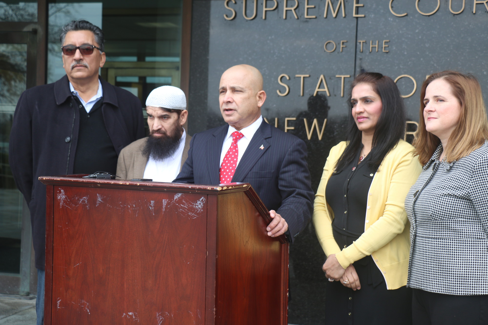 Ali Mirza, center, organized the news conference. He was joined by, from left, Ijaz Bokhari, imam Mohammad Usman, Jaweria Safdar-Mirza and Mary Moreno.