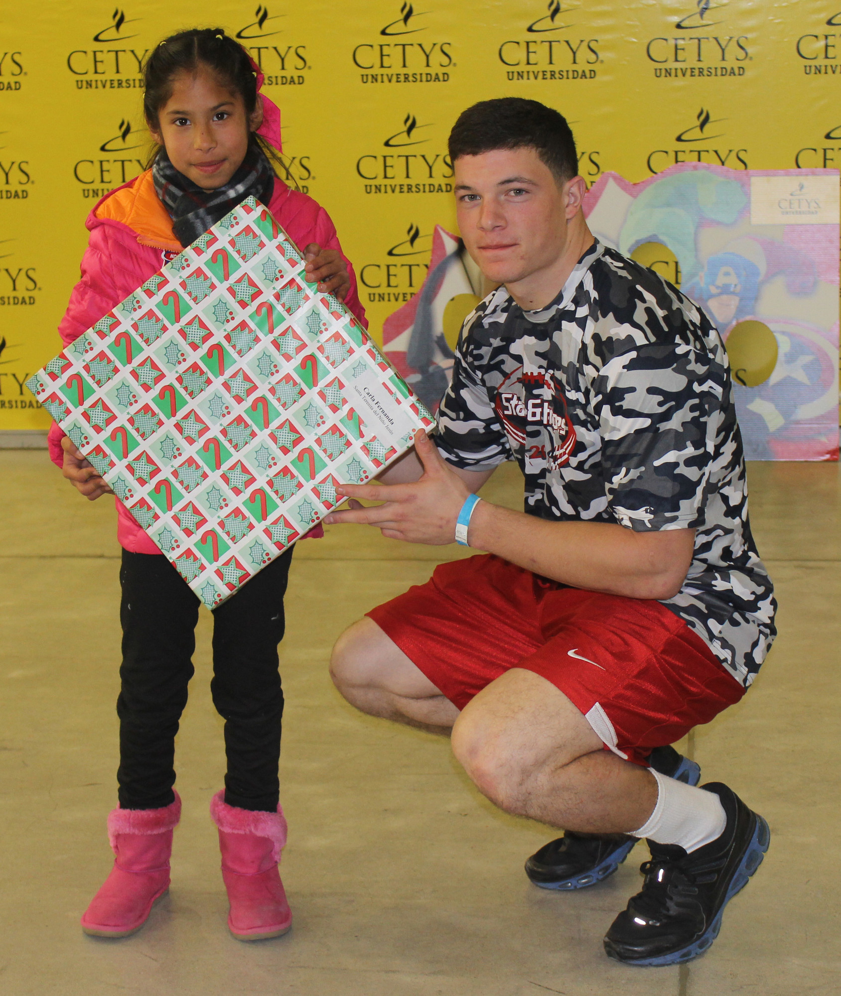 USMMA senior Matt McDaniels visited with a local orphanage prior to his participation in the Bowl of the Stars football game in Baja, Mexico on Dec. 20.