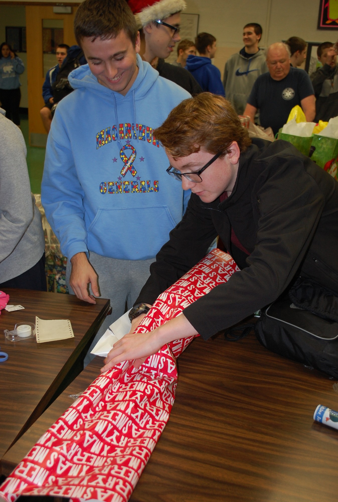 Peter D’Angelo and Greg Matousek, of MacArthur's National Honor Society, helped to wrap the presents.
