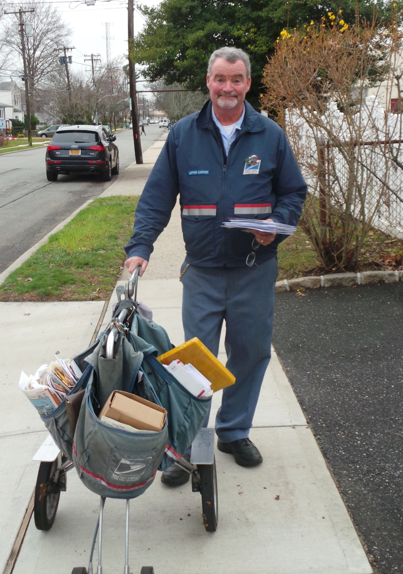 Walter Malloy, a 35-year veteran of the Malverne Post Office, delivered mail along the route he has had for the past 33 years.
