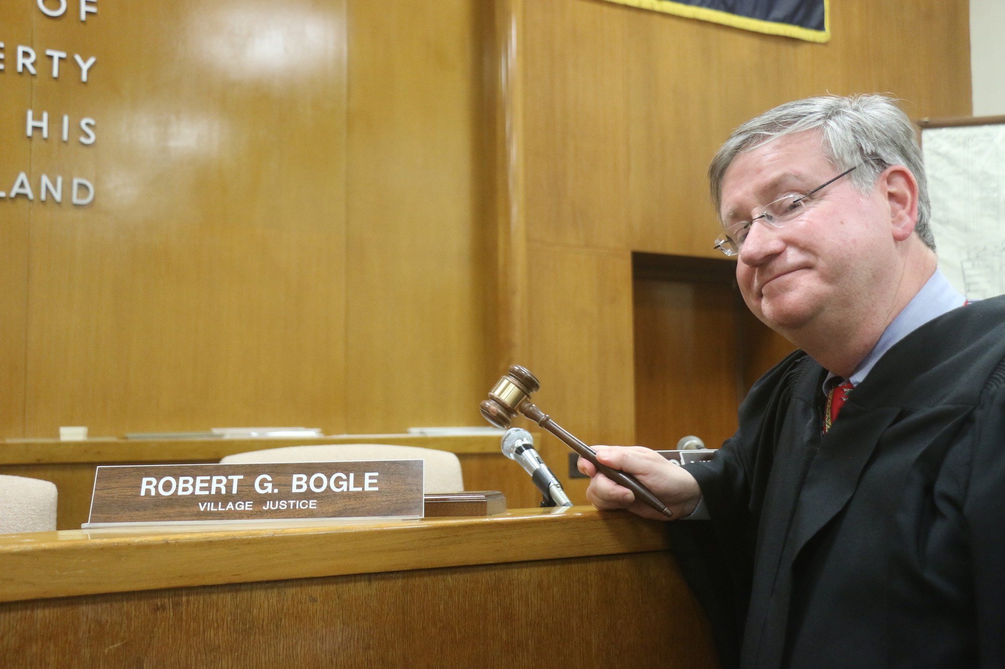Village Justice Robert Bogle plans to step down at the end of the year to assume his County Court judgeship.