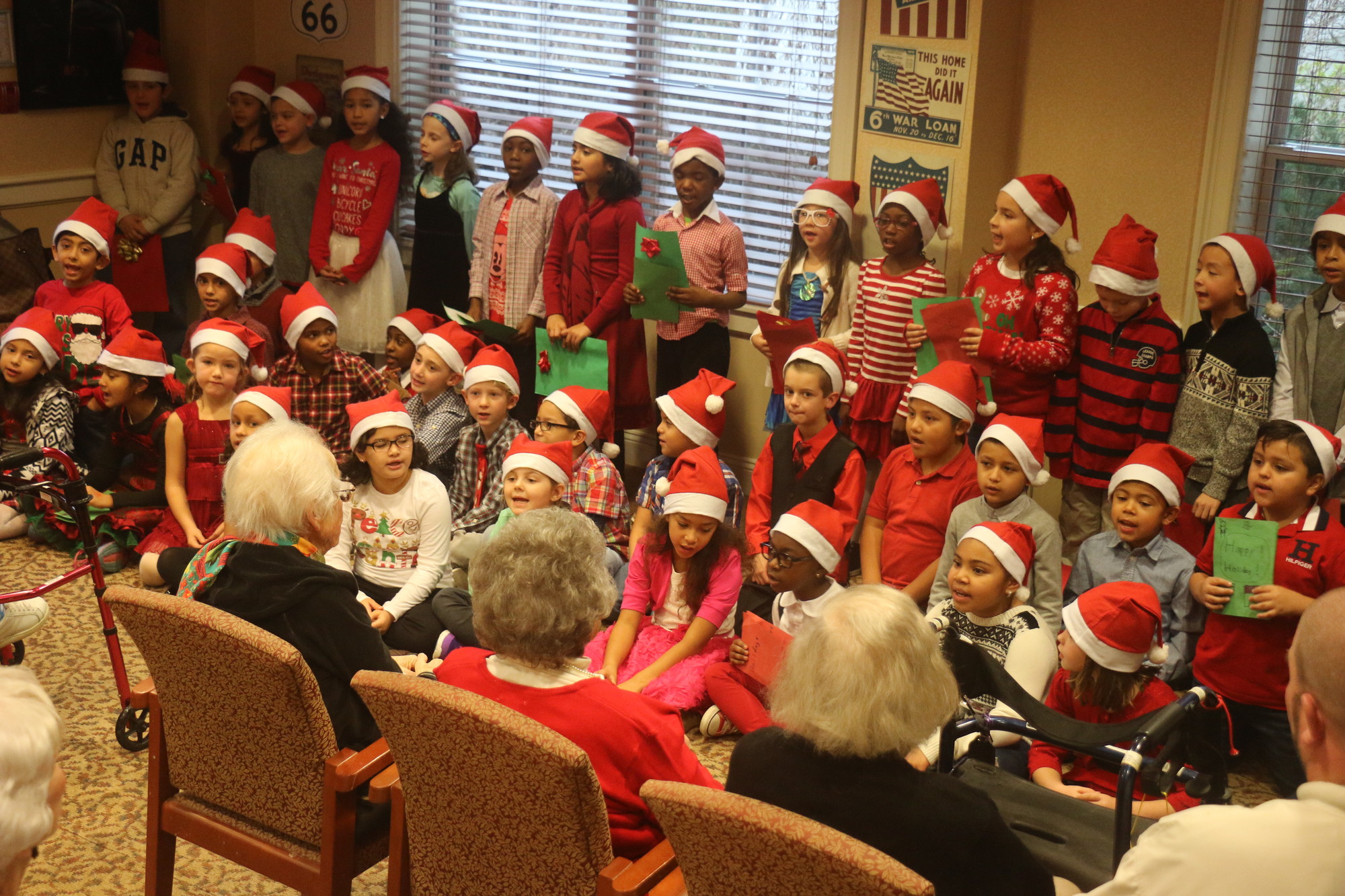 William L. Buck Elementary School students sang carols and recited holiday verses at the Atria Tanglewood assisted living facility in Lynbrook on Dec. 17.