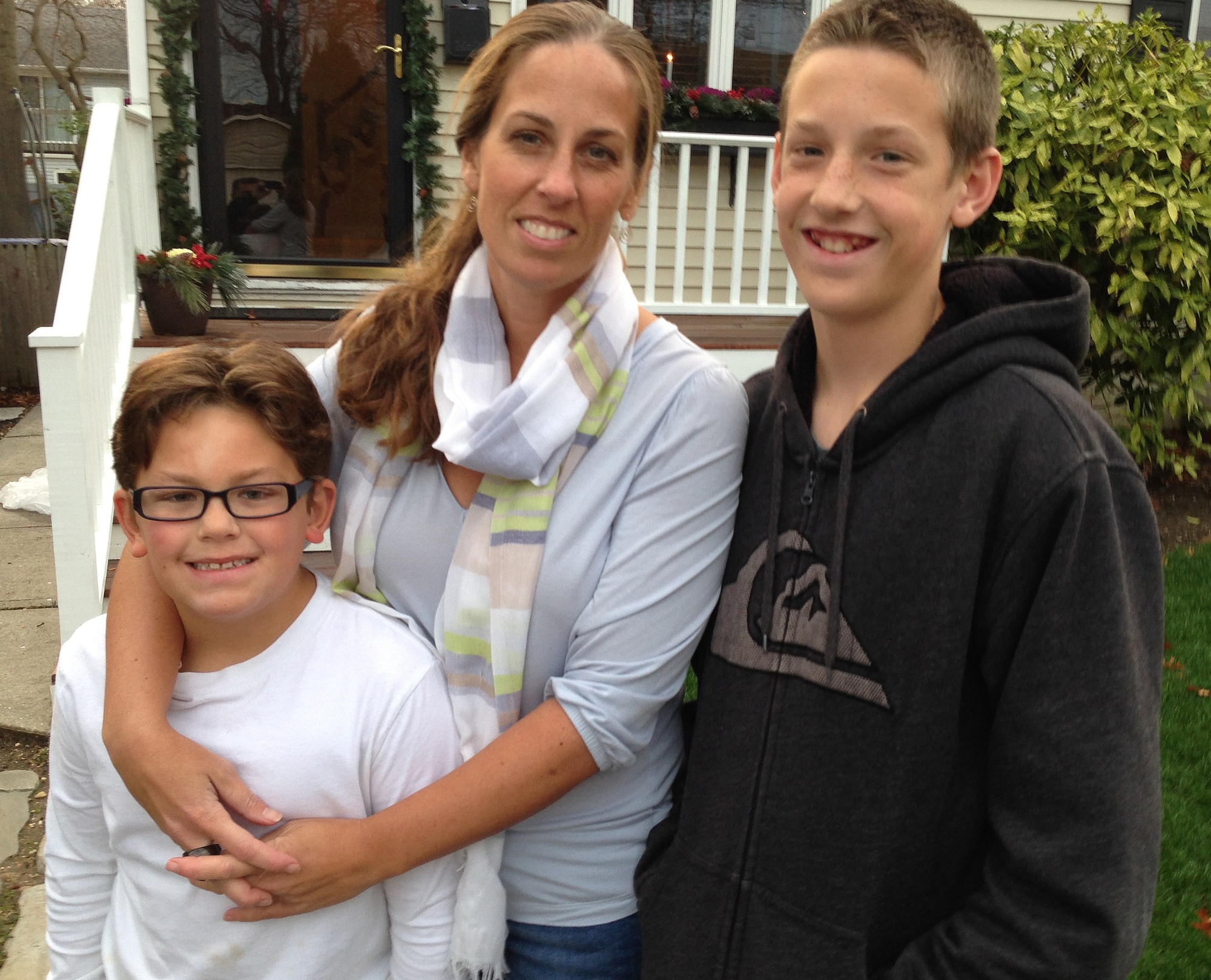 For all that Jeanette Deutermann has done to reform New York's education system, she is the Bellmore Herald Life's 2015 Person of the Year. She is joined here by her sons, Jack, left, and Tyler.