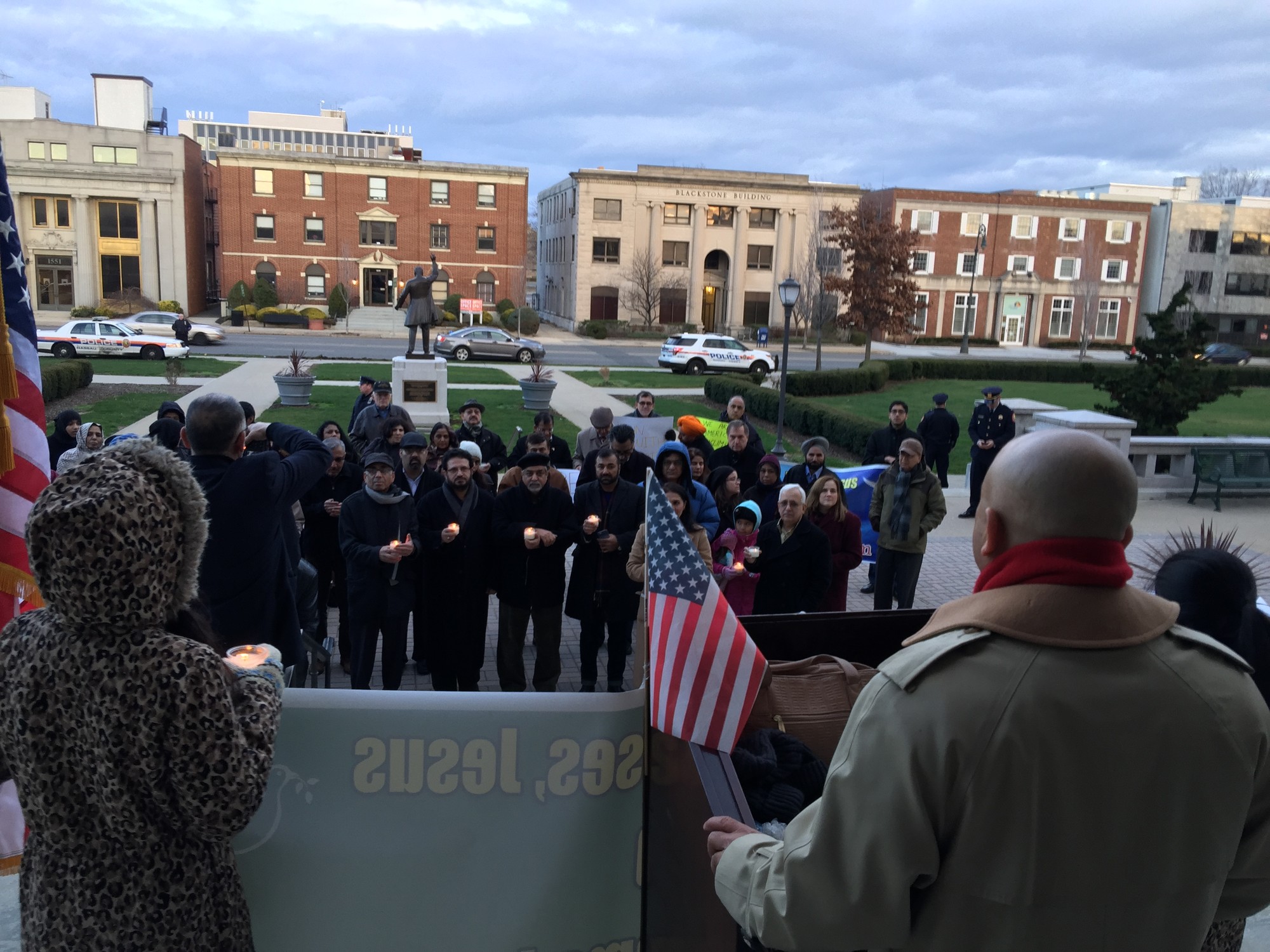 Ali Mirza, right spoke at the Nassau County Executive Building on New Year’s Day to the crowd about the need to educate people on the teachings of Islam.