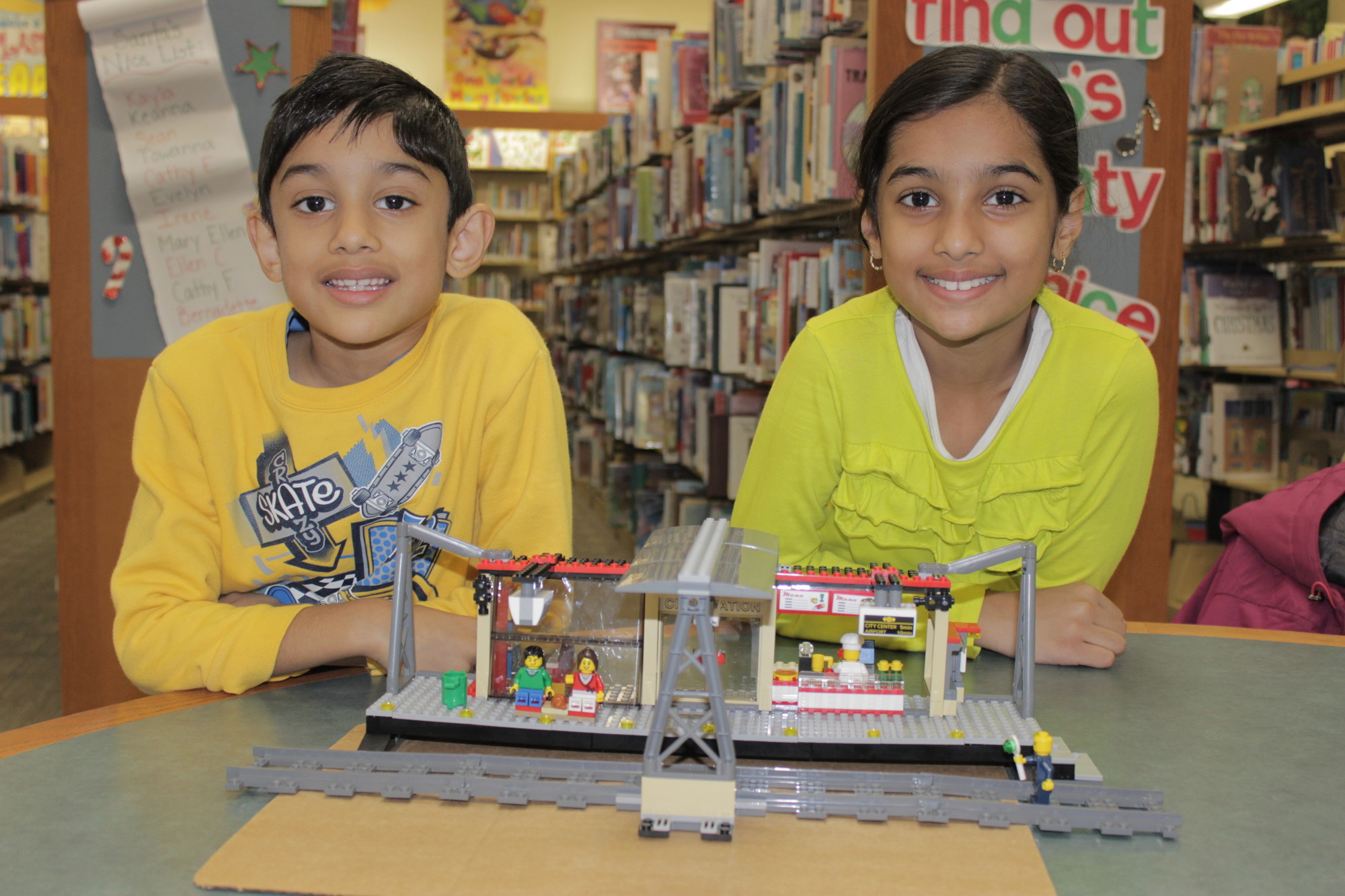 Arvind, 6, left, and his sister, Asha, 8, collaborated on a train station, sans the train.