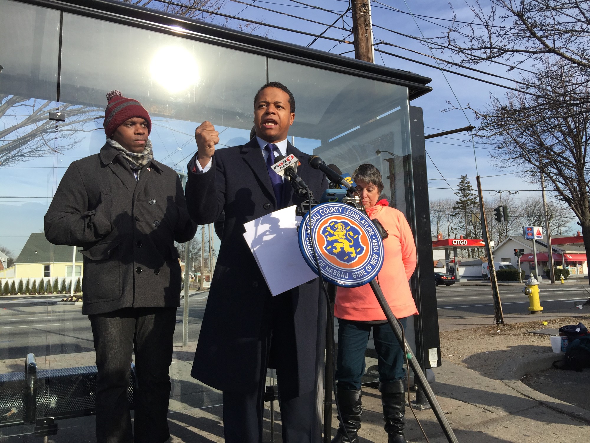 County Legislator Carrié Solages held a press conference in front of a bus stop on Hempstead Turnpike in Elmont on Jan. 7, and asked County Executive Ed Mangano for a two-month freeze on cuts to the system.