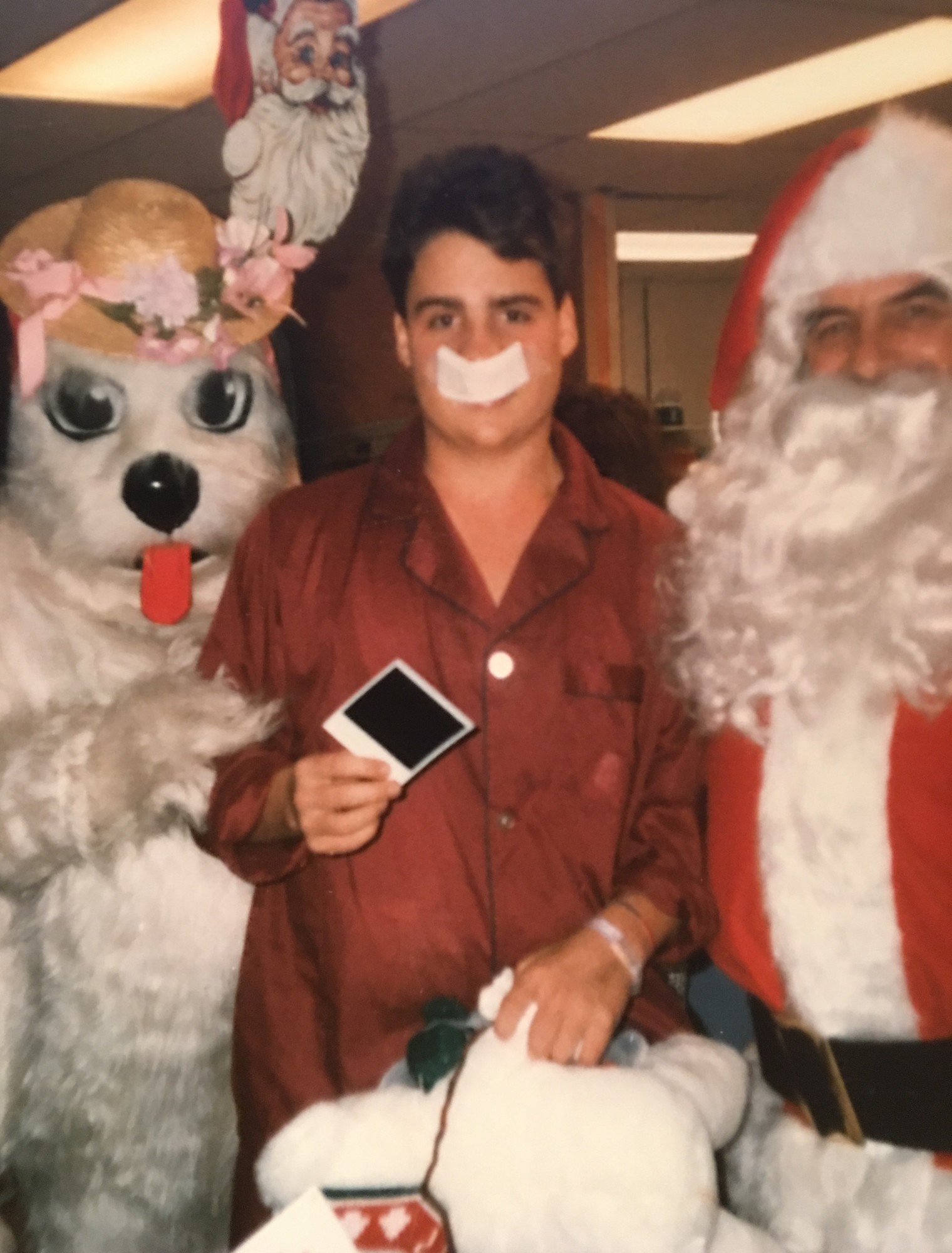 John Theissen held the teddy bear that Tasha asked Santa to bring him when he was in the hospital 27 years ago.