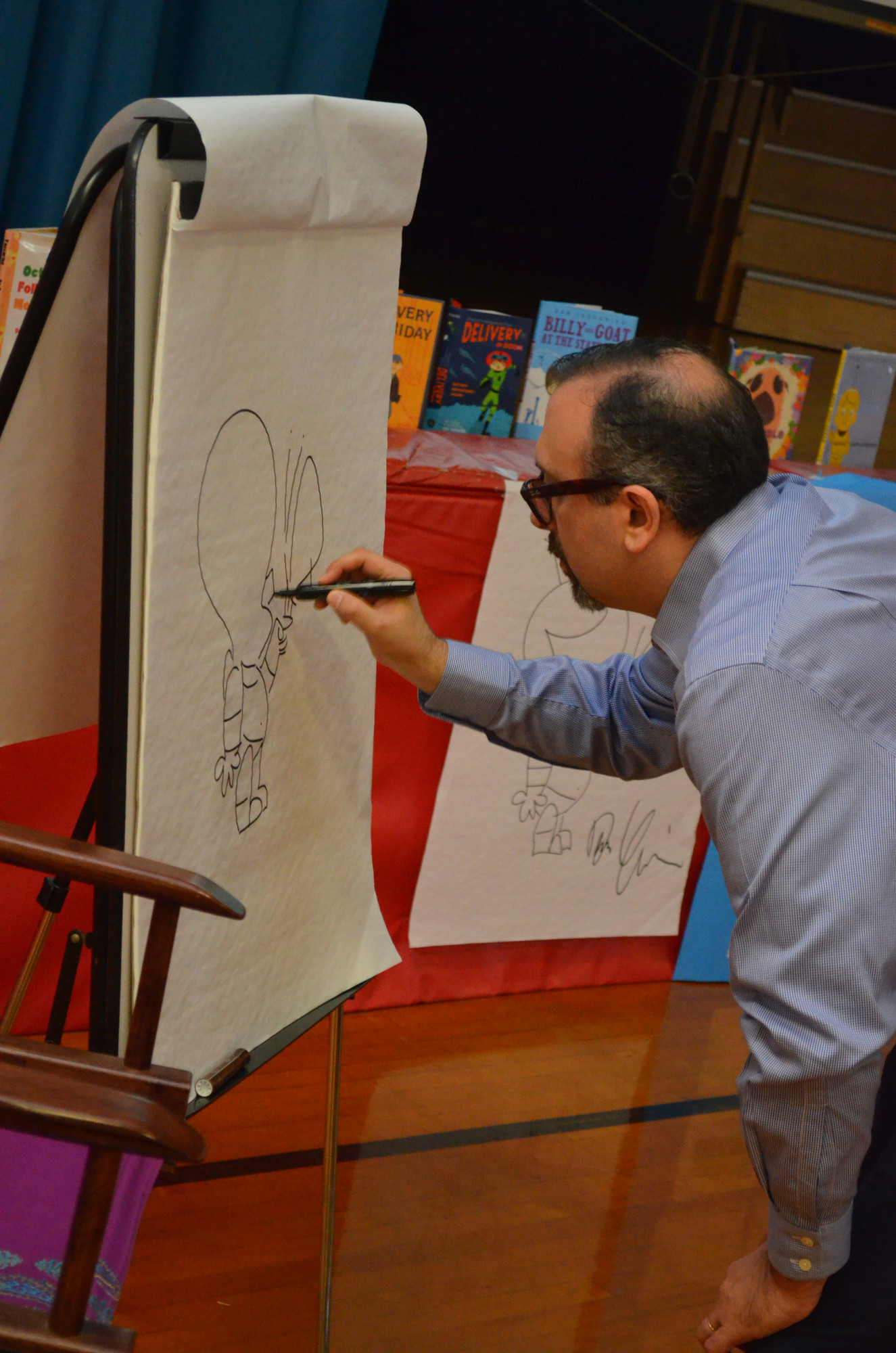 Yaccarino drew a picture of his character Doug for Riverside students.