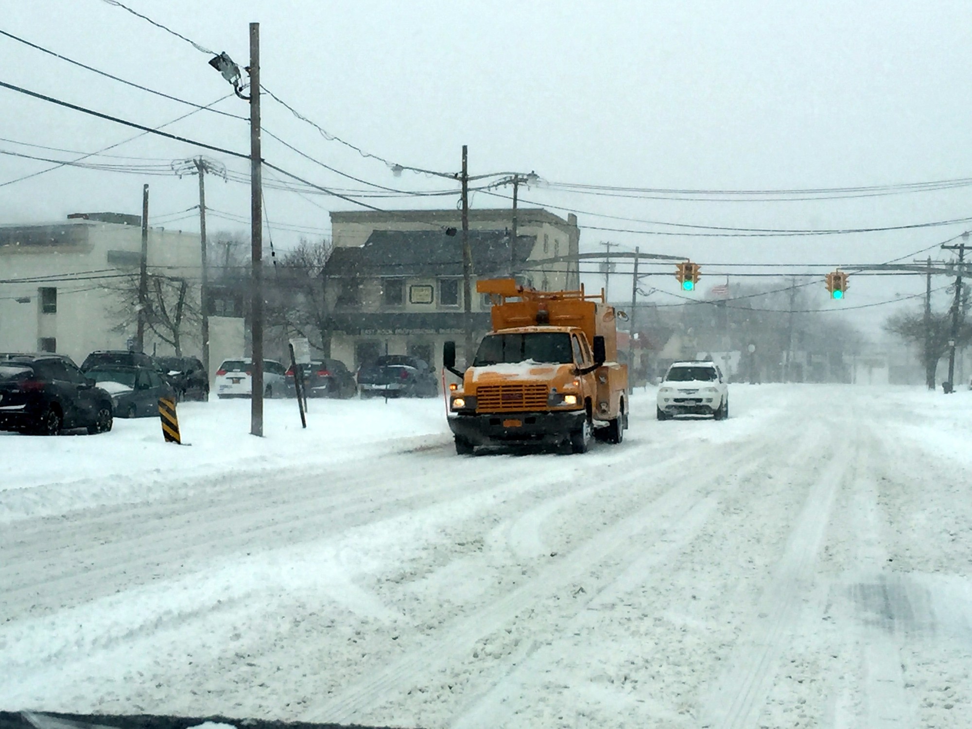 Utilities trucks and snow plows are out at the height of the storm.