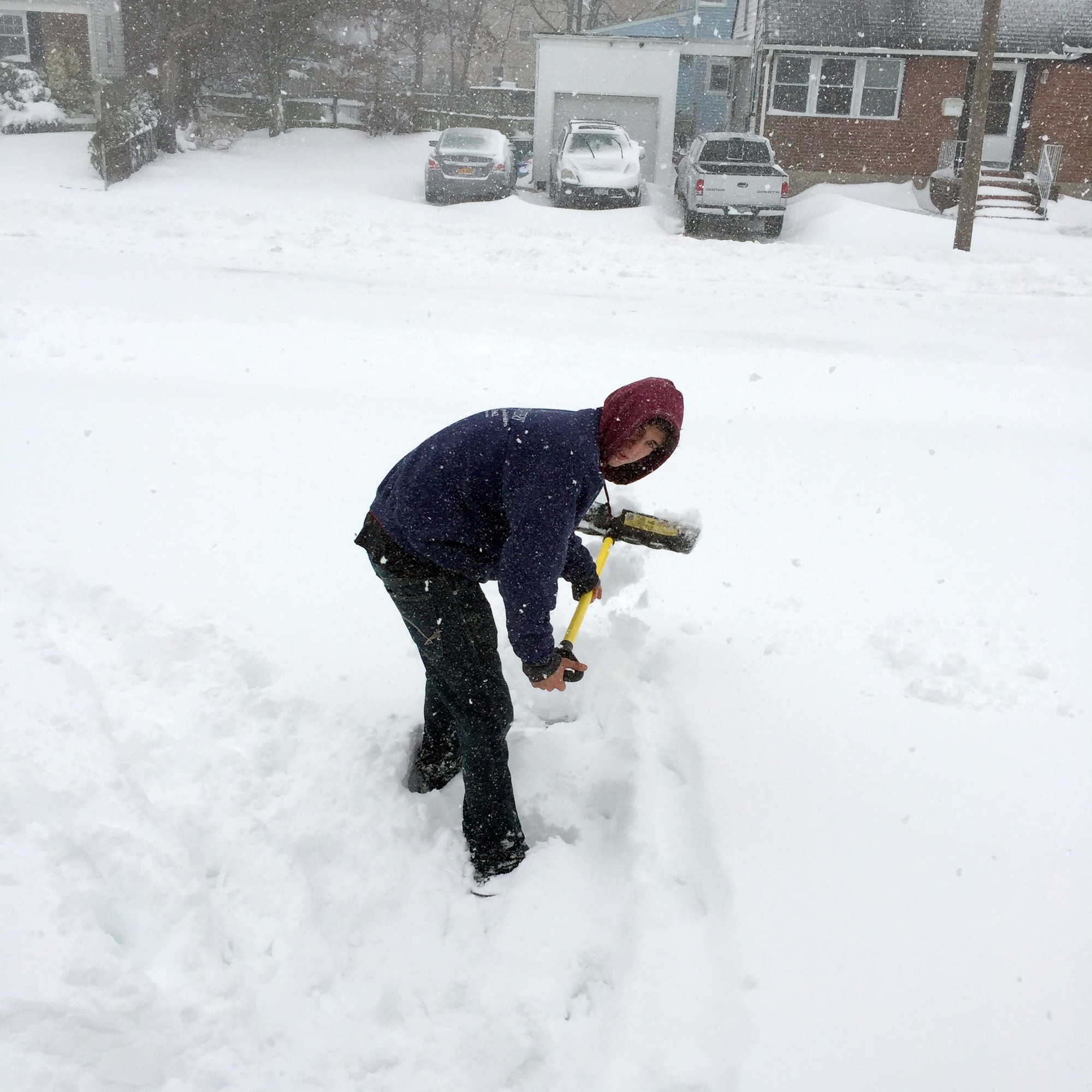 Paul Valgoi shovels in front of his East Rockaway home, just to get a head start on the storm.