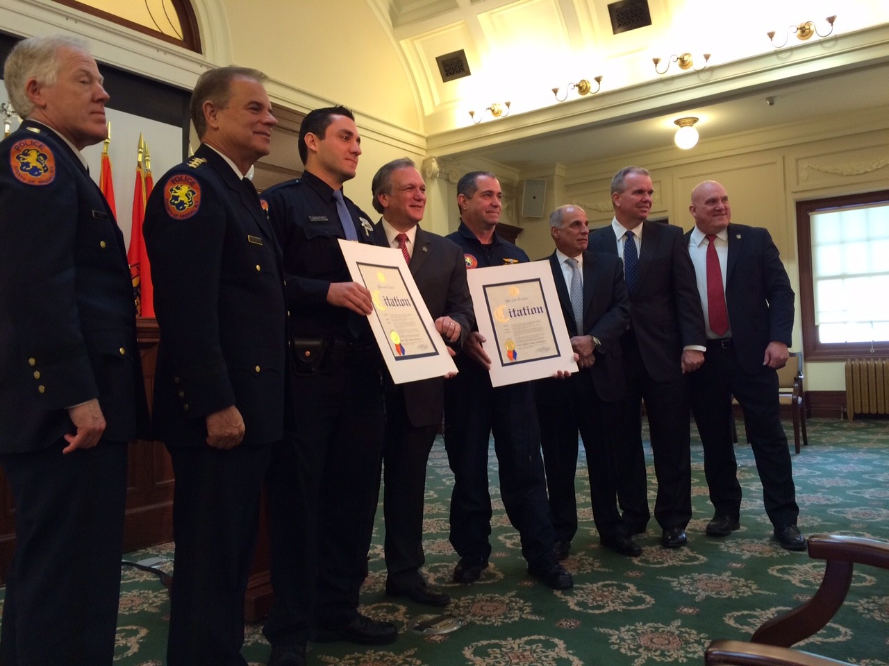 County Executive Ed Mangano honored officers James Sarnataro Jr., third from left, and James Sarnataro Sr., for their parts in the rescue of a drowning man. (Rebecca Melnitsky/Herald)