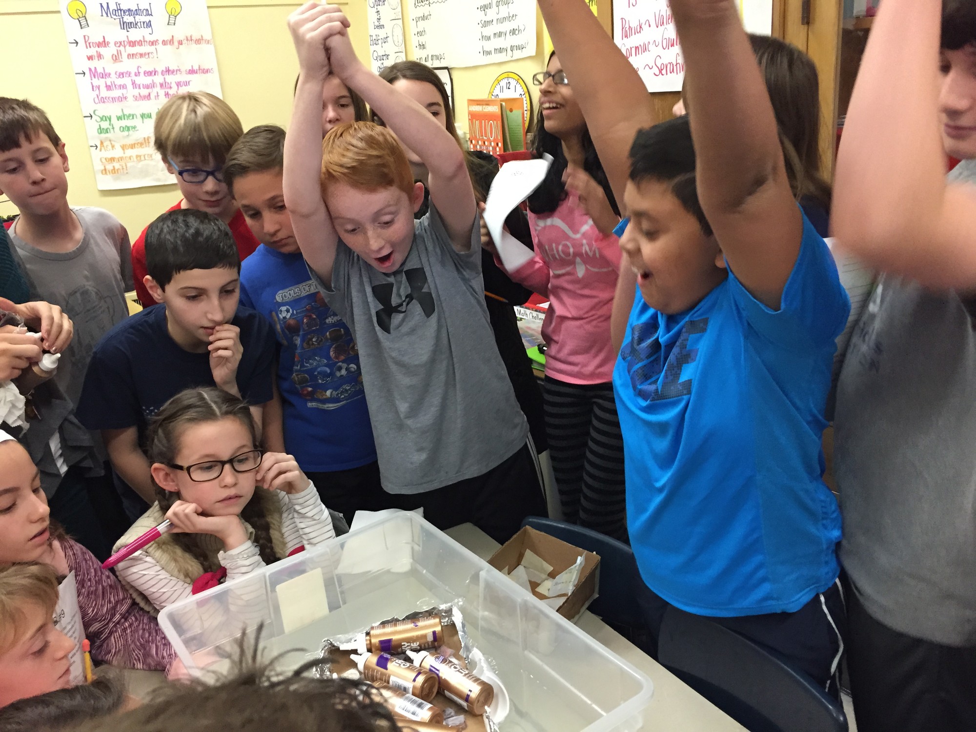 Students express their glee when getting the supplies for a design challenge in STEM lab.