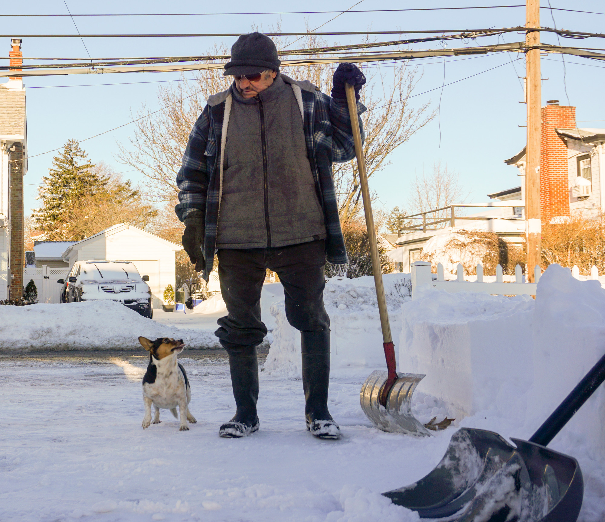Mario Zano shoveled his driveway on Ocean Avenue with support from his pal, Walter.