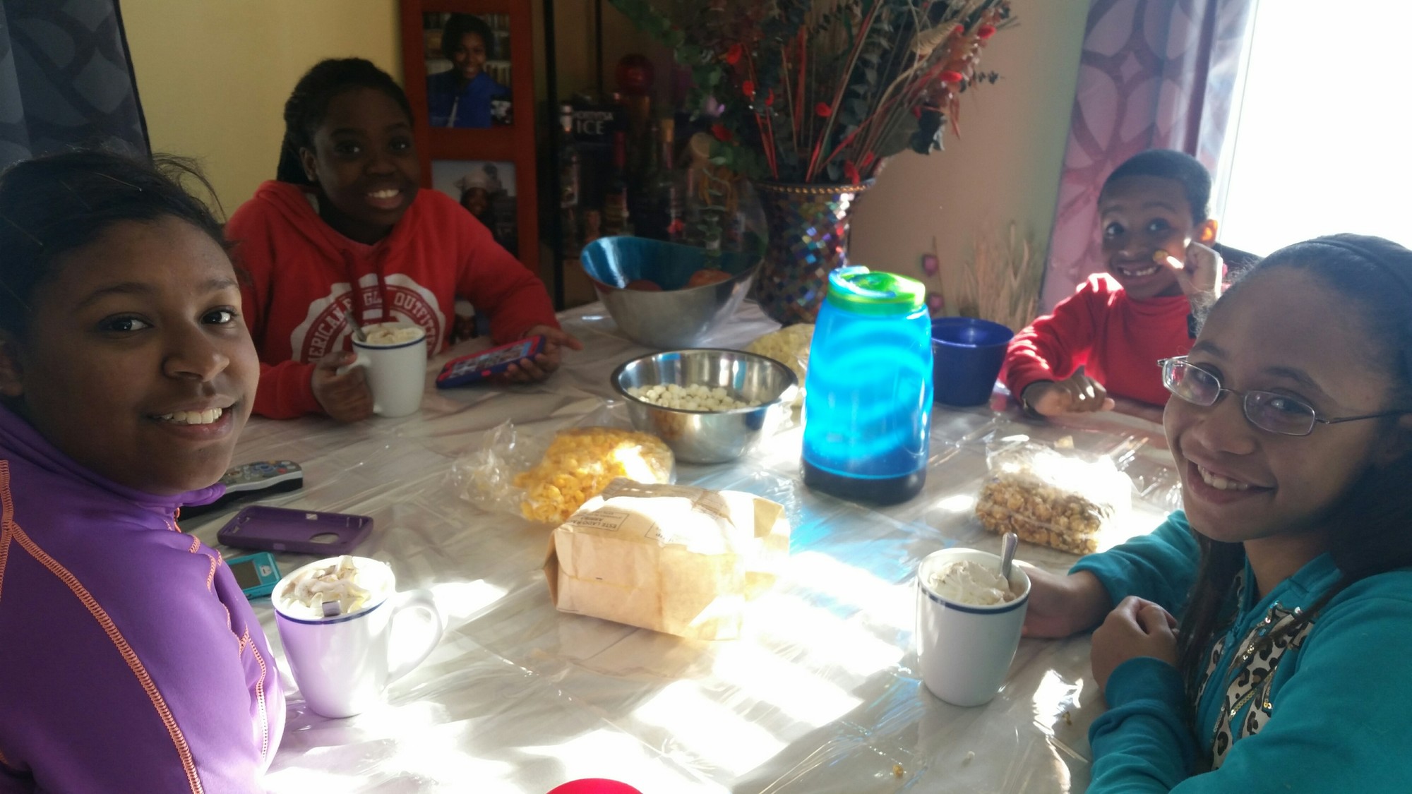All of the activity outside the Barter family’s Copiague Street home was     followed by a hot chocolate session. Ashley, 12, second from left, joined, from left, Amiya, Jaylen and Rasheedah.