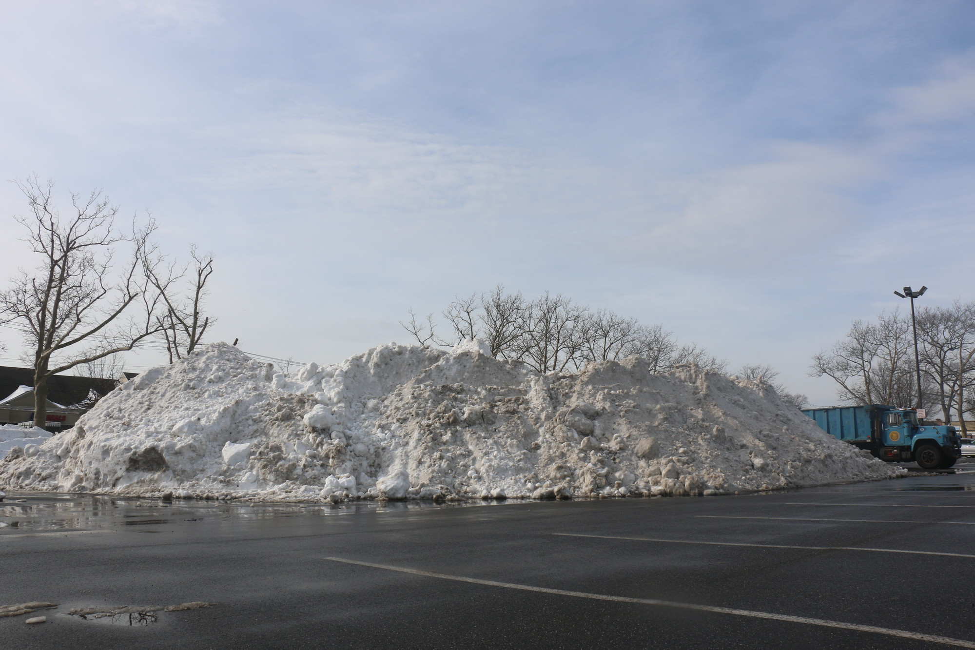 Village crews piled snow in large mounds in the pool complex’s parking lot.