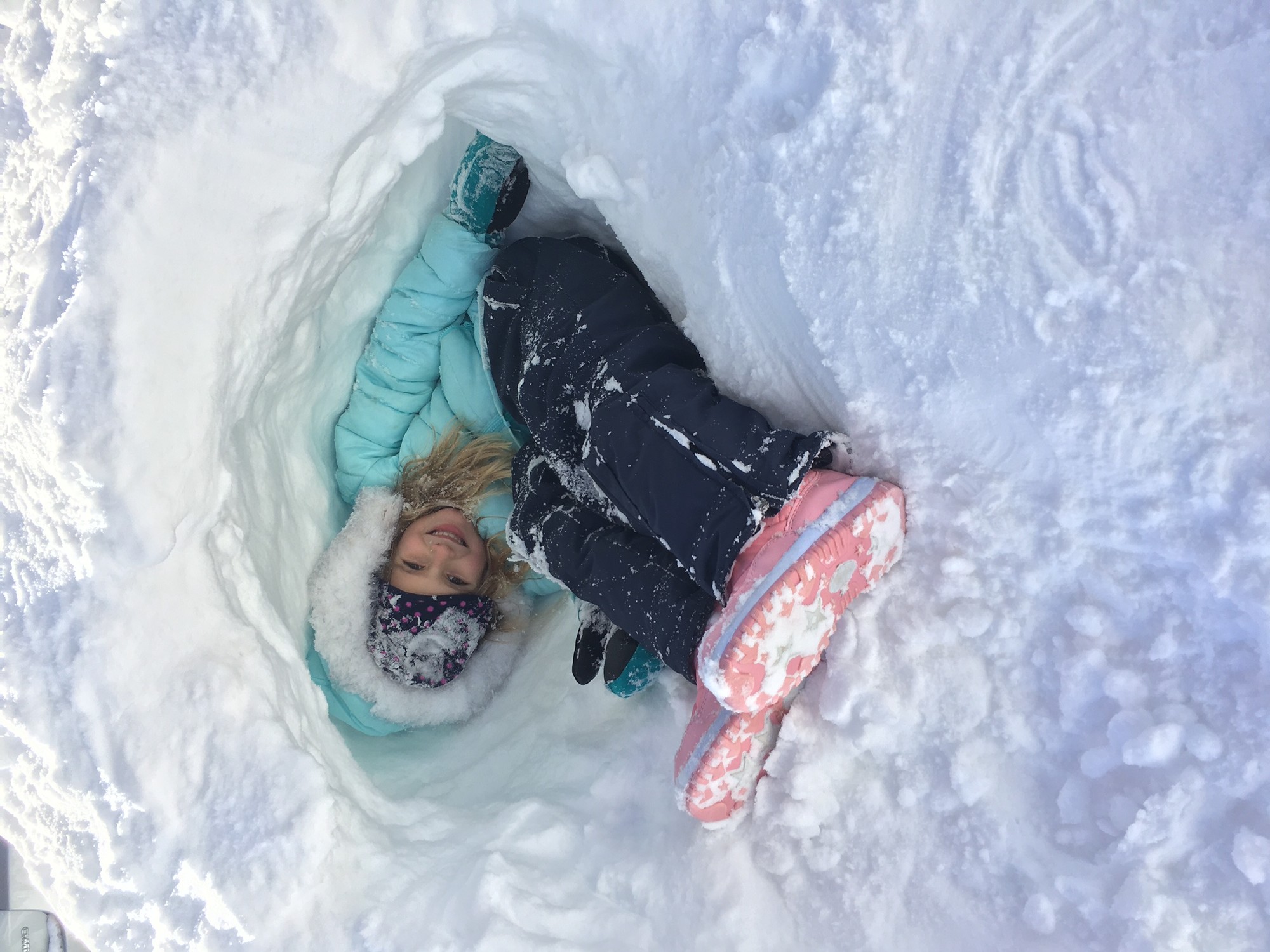 Hannah Wallach, 8, tucked herself into the snow tunnel she dug on Locust Street.