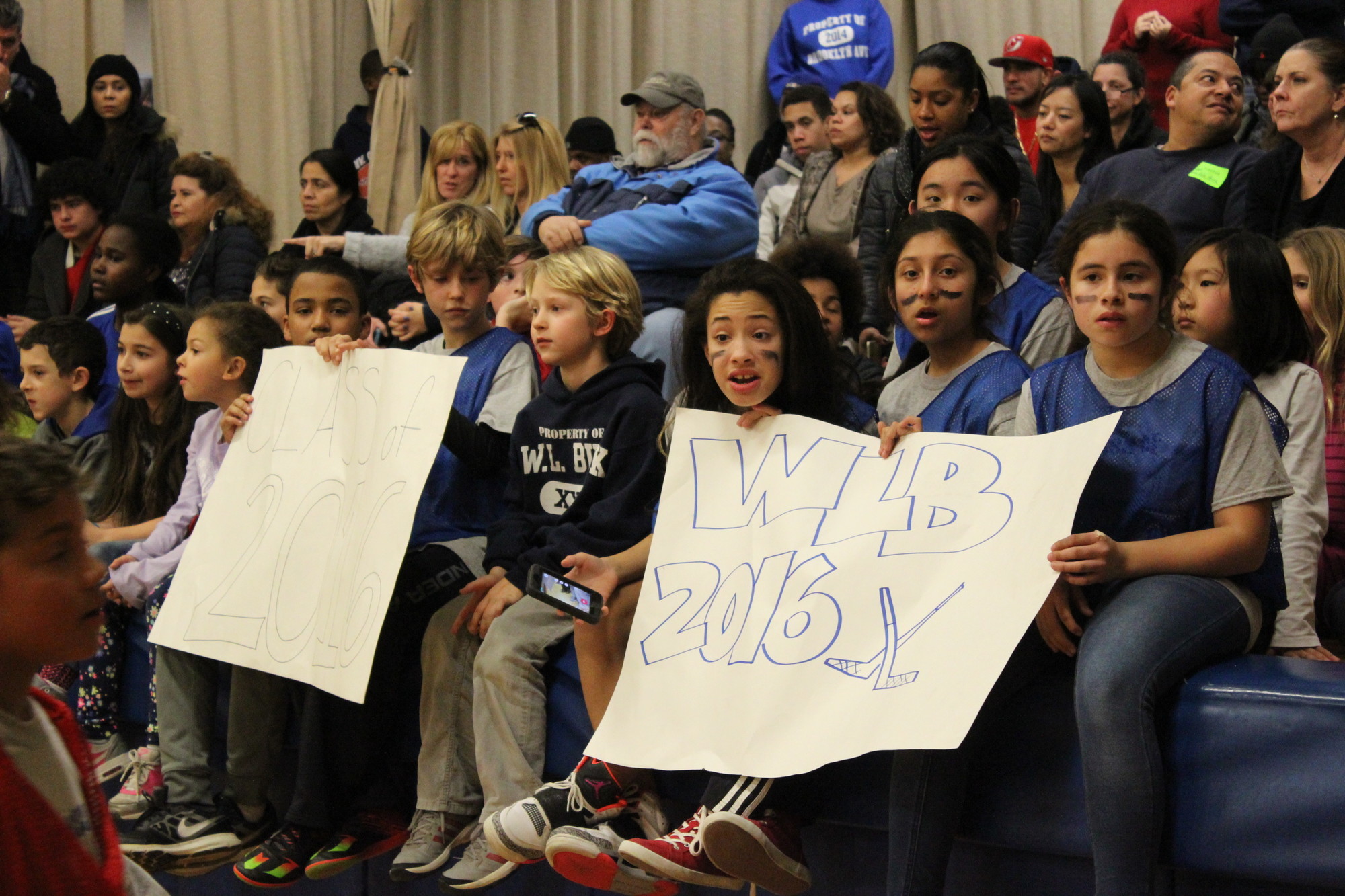 Sixth-graders waved homemade banners and screamed their 
support for their classmates on Jan. 21.