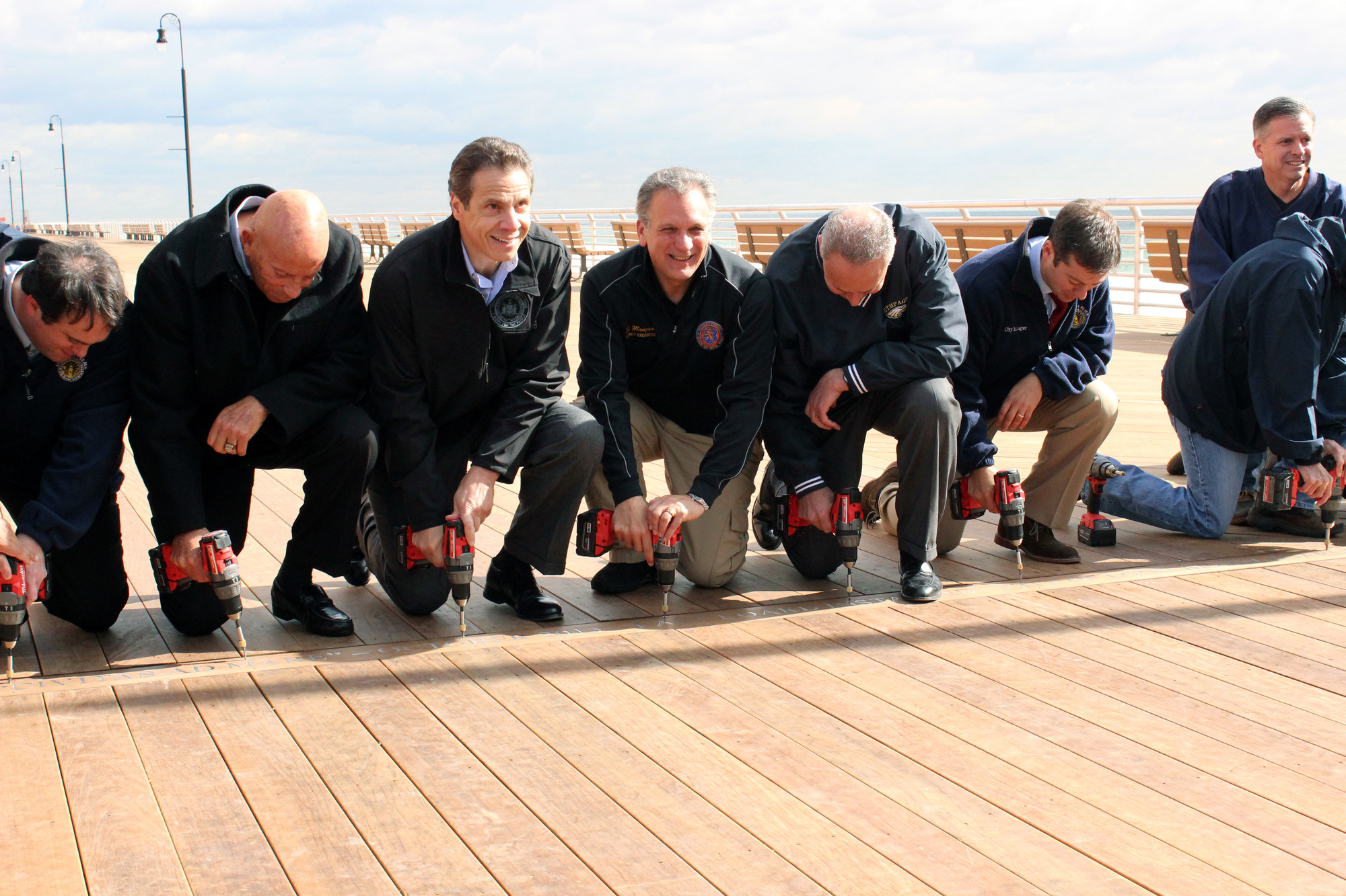 City Councilman Scott Mandel, far left, former State Assemblyman Harvey Weisenberg, Gov. Andrew Cuomo, Nassau County Executive Ed Mangano, Sen. Charles Schumer and City Manager Jack Schnirman screwed in the last plank of the new boardwalk in 2013.