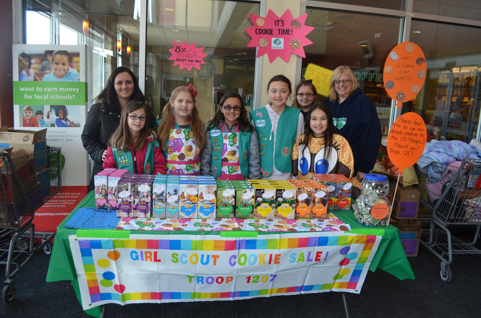 Christy McKenna, far left, helped scouts, from left Caroline Dilman, Marley Hunt, Emily McKenna, Brianna Suarez Oubina, Kristina Mazarese, Cassandra O’Connell, raise money for the ‘Adopt the Pike’ program with co leader Lisa Mazarese.