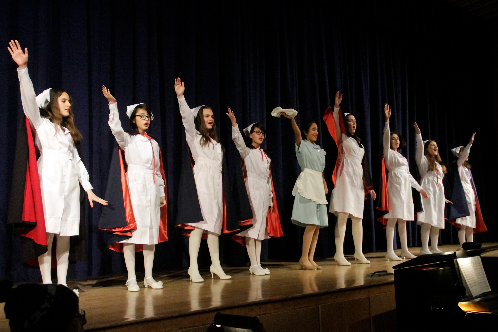 Lavinia (Keriana Calderon) and the nurses gave a salute. (Susan Grieco/Herald)
