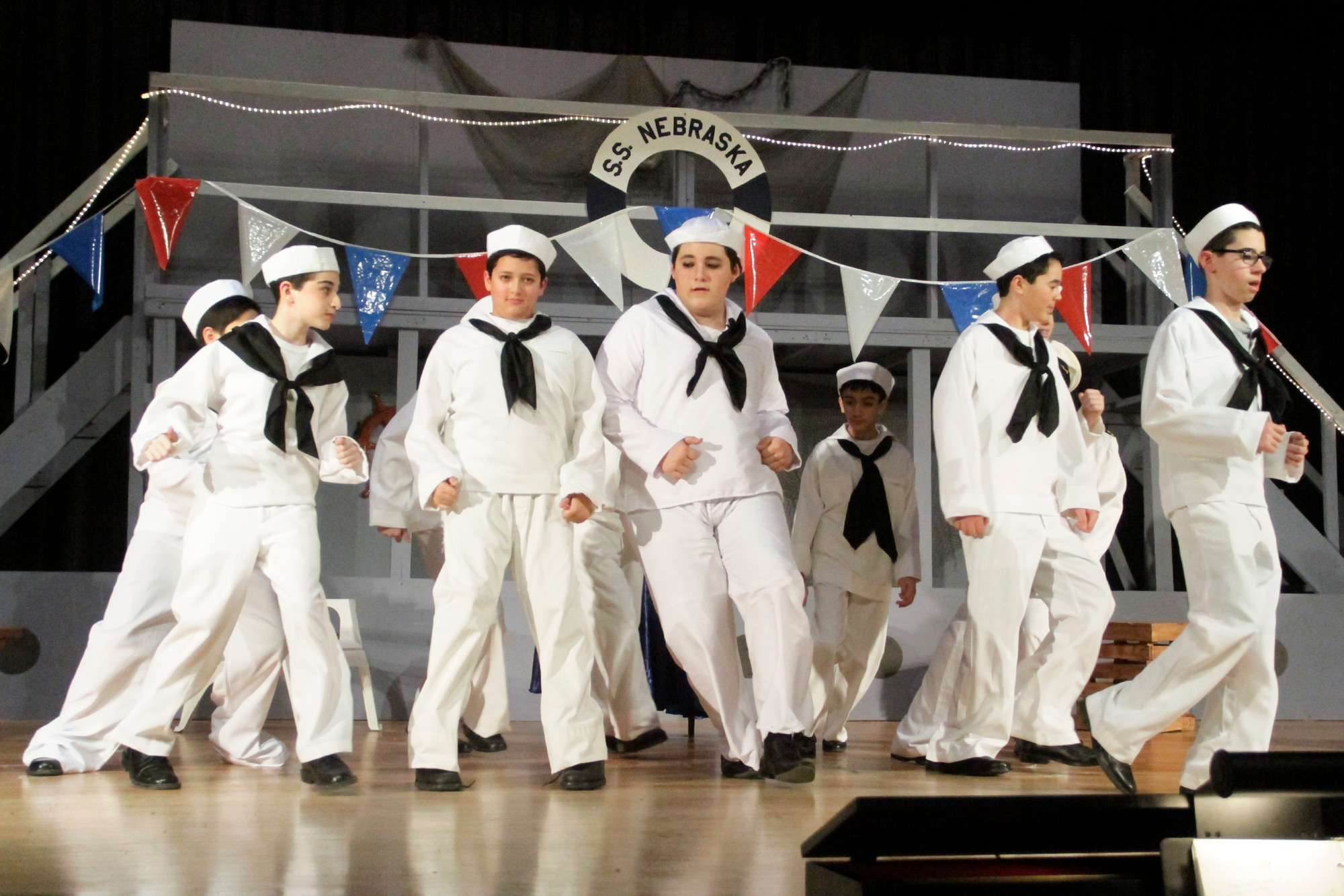 The sailors show off their steps for the dance number.