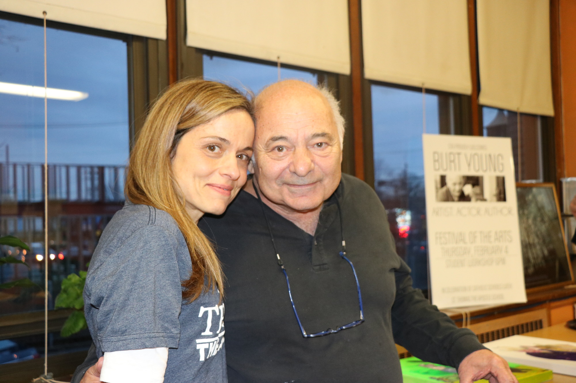 Actor Burt Young with St. Thomas the Apostle teacher Daniela Picone at a painting event at the school Thursday evening.